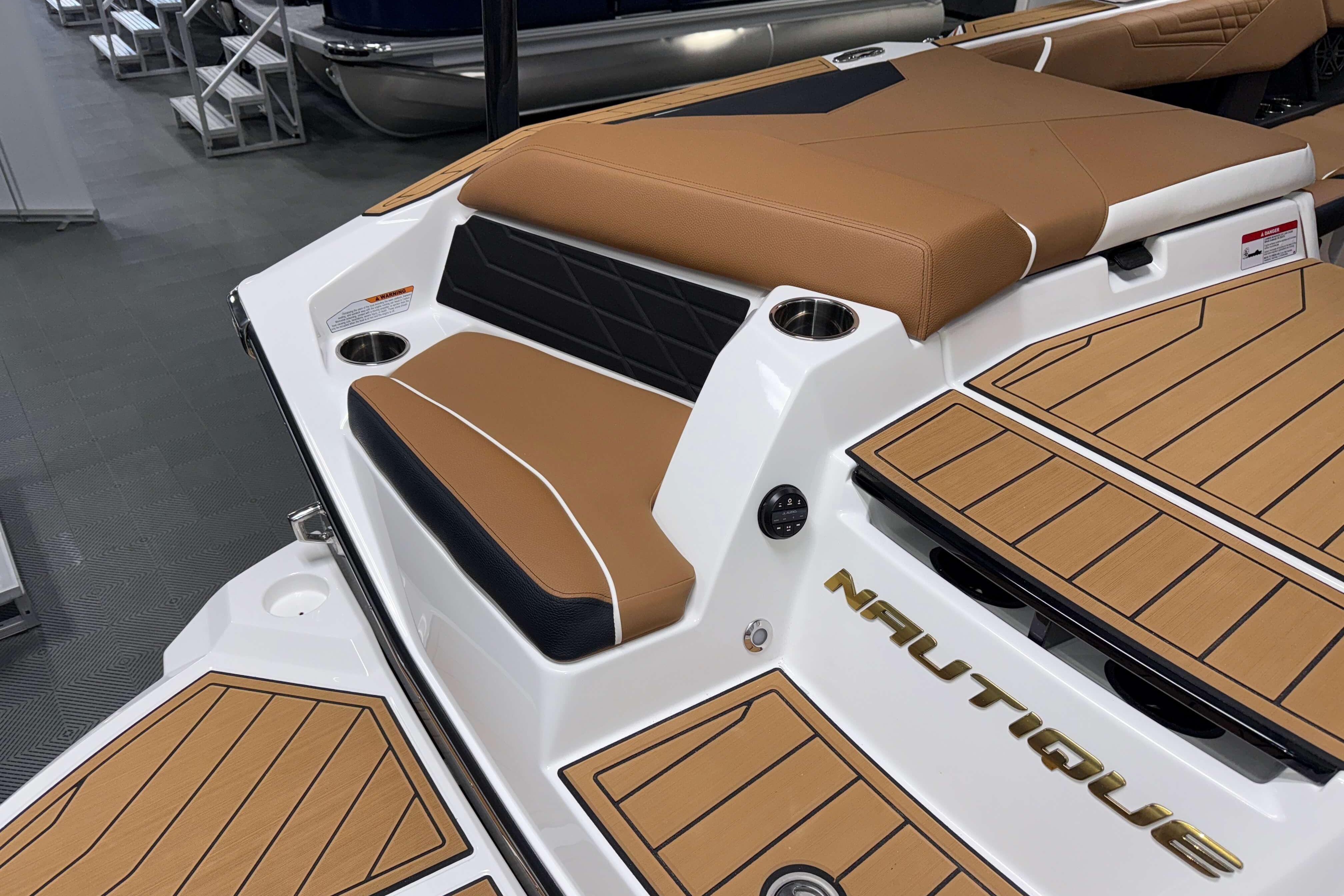 2026 Nautique Super Air Nautique S23 boat with tan seating and deck, showcasing luxury design.
