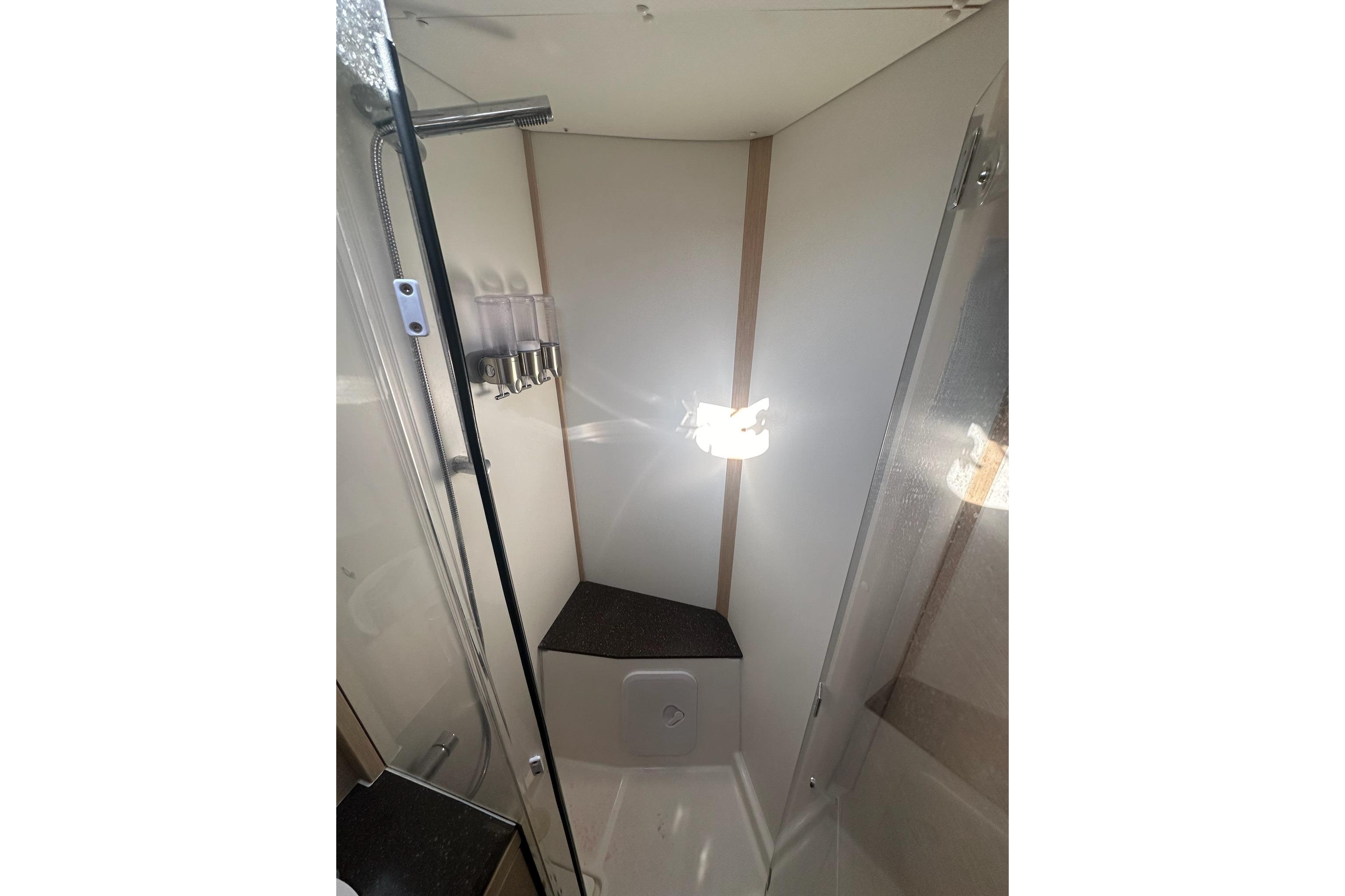 Modern shower area in a 2018 Jeanneau 51 yacht, featuring sleek design and fixtures.