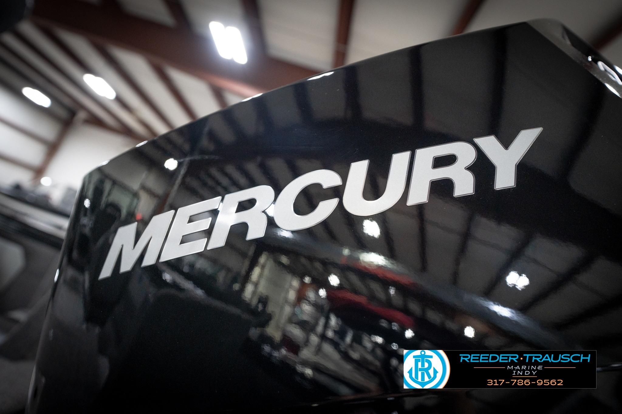 2026 Lund 2275 Baron boat with Mercury engine in showroom.