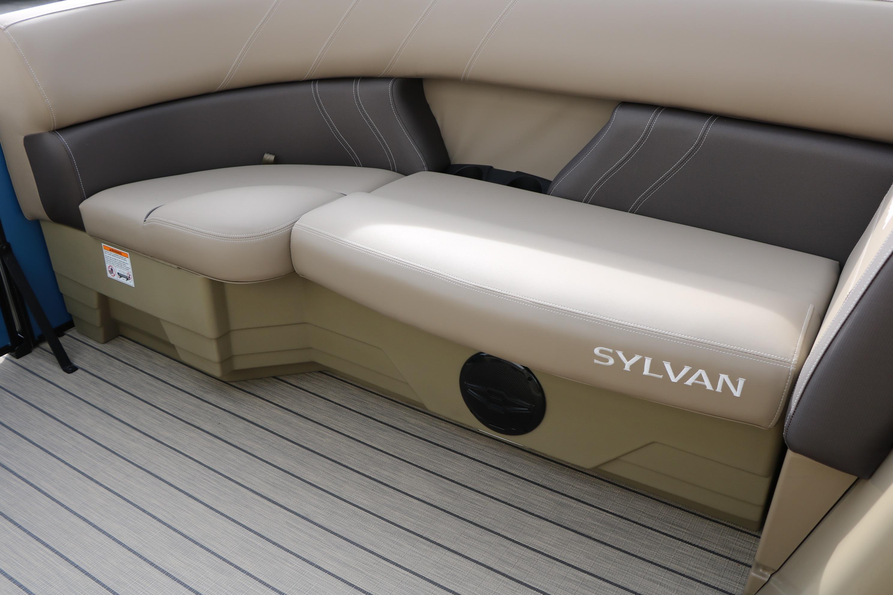 2026 Sylvan Mirage 822 LZ boat interior seating with beige and brown upholstery.