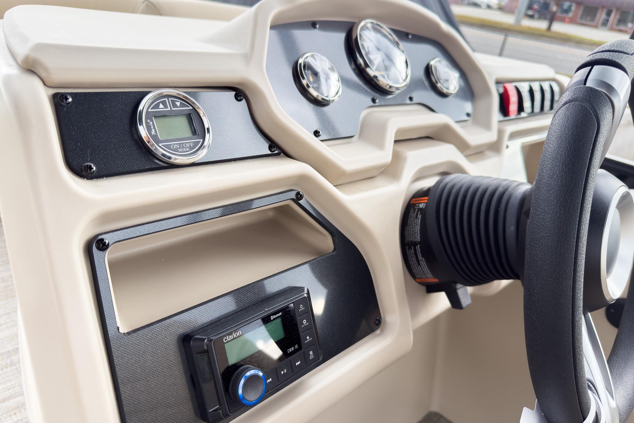 Dashboard of 2026 Godfrey Sweetwater Xperience 22' Tritoon with steering wheel and controls.