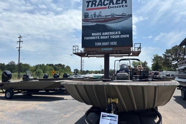 2026 Tracker Grizzly 2072 CC boat displayed outdoors under a Tracker Boats sign.