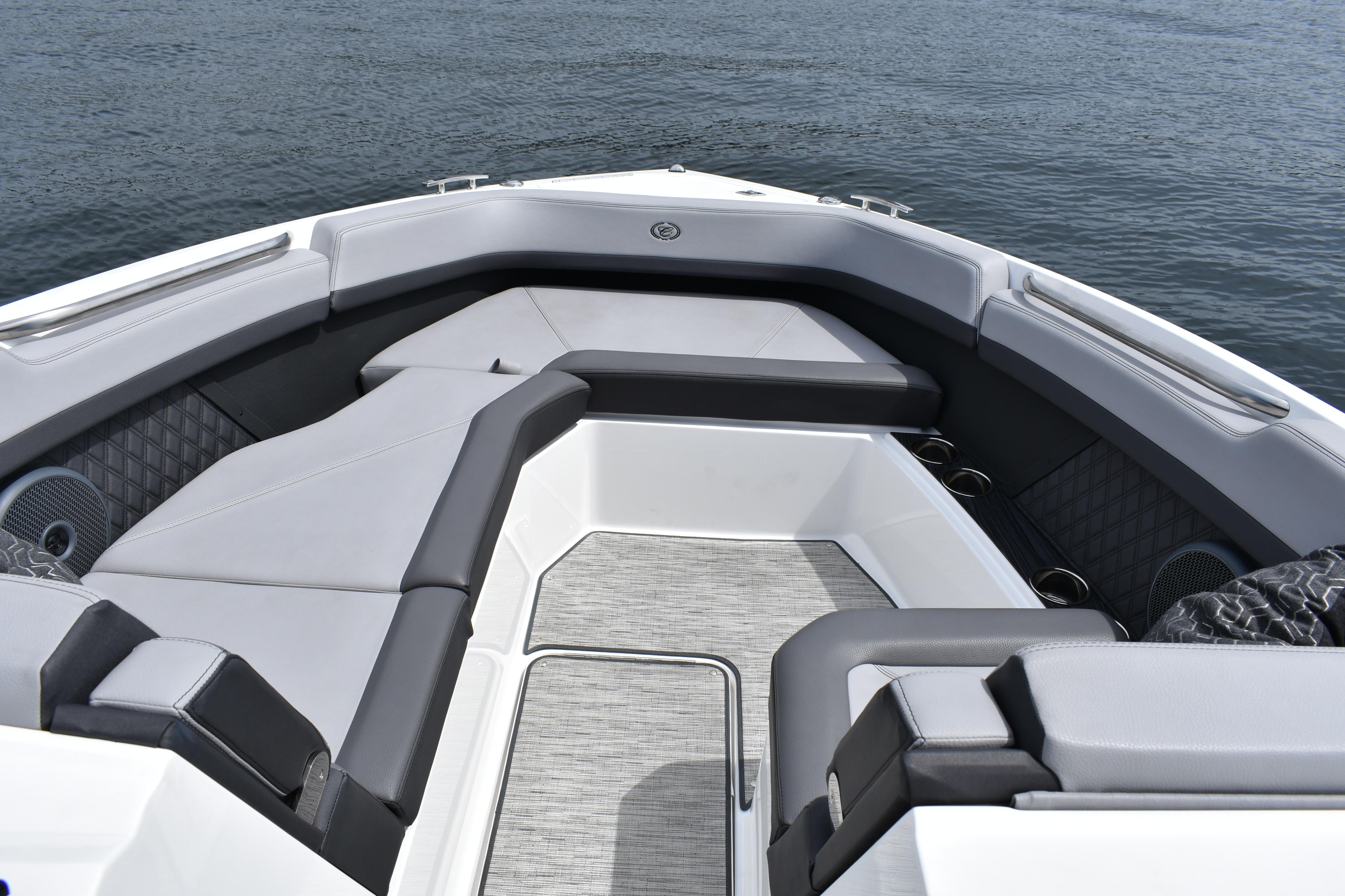 2023 Cobalt R8 boat interior with luxurious seating on calm water.