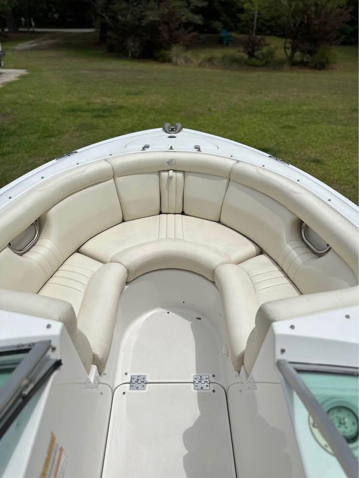 2001 Chris-Craft Launch 22 boat interior with white leather seating.