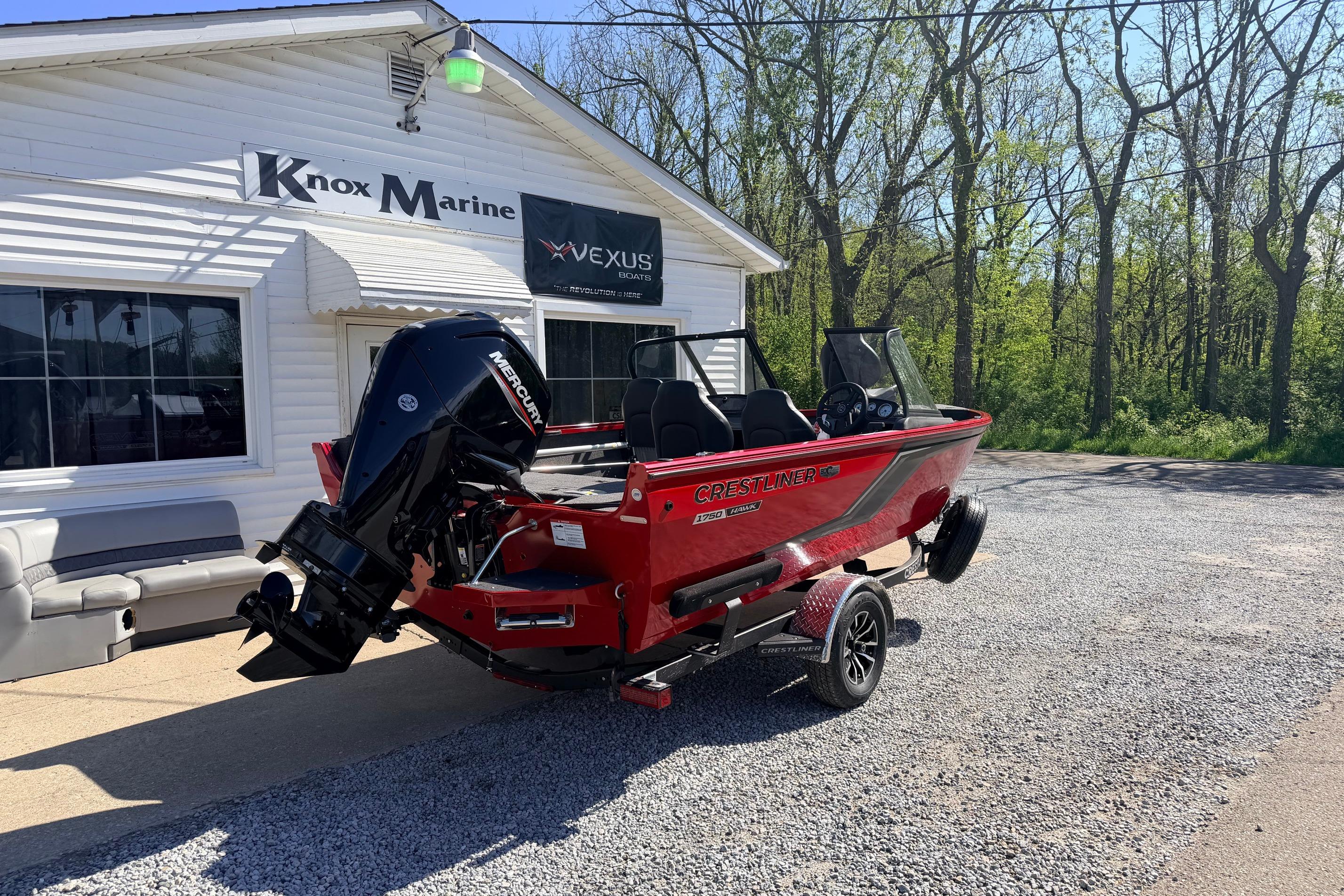 2026 Crestliner 1650 Kodiak WT boat in red, parked outside Knox Marine.
