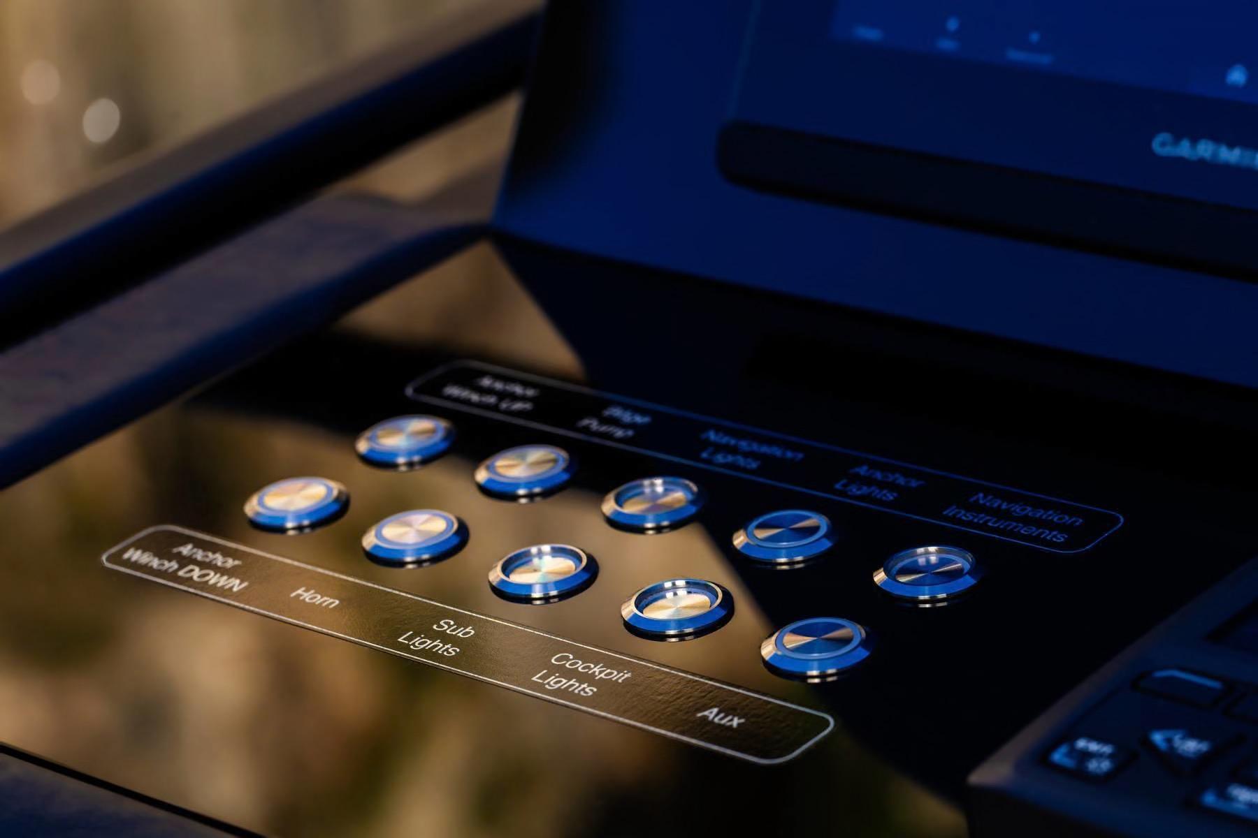 Control panel of 2026 Cranchi A32 Luxury Tender with illuminated buttons.