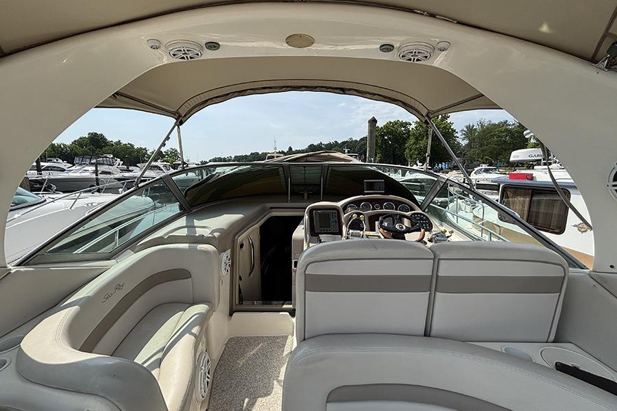 Interior view of a 2002 Sea Ray Sundancer 320 yacht, featuring a spacious cockpit and helm.