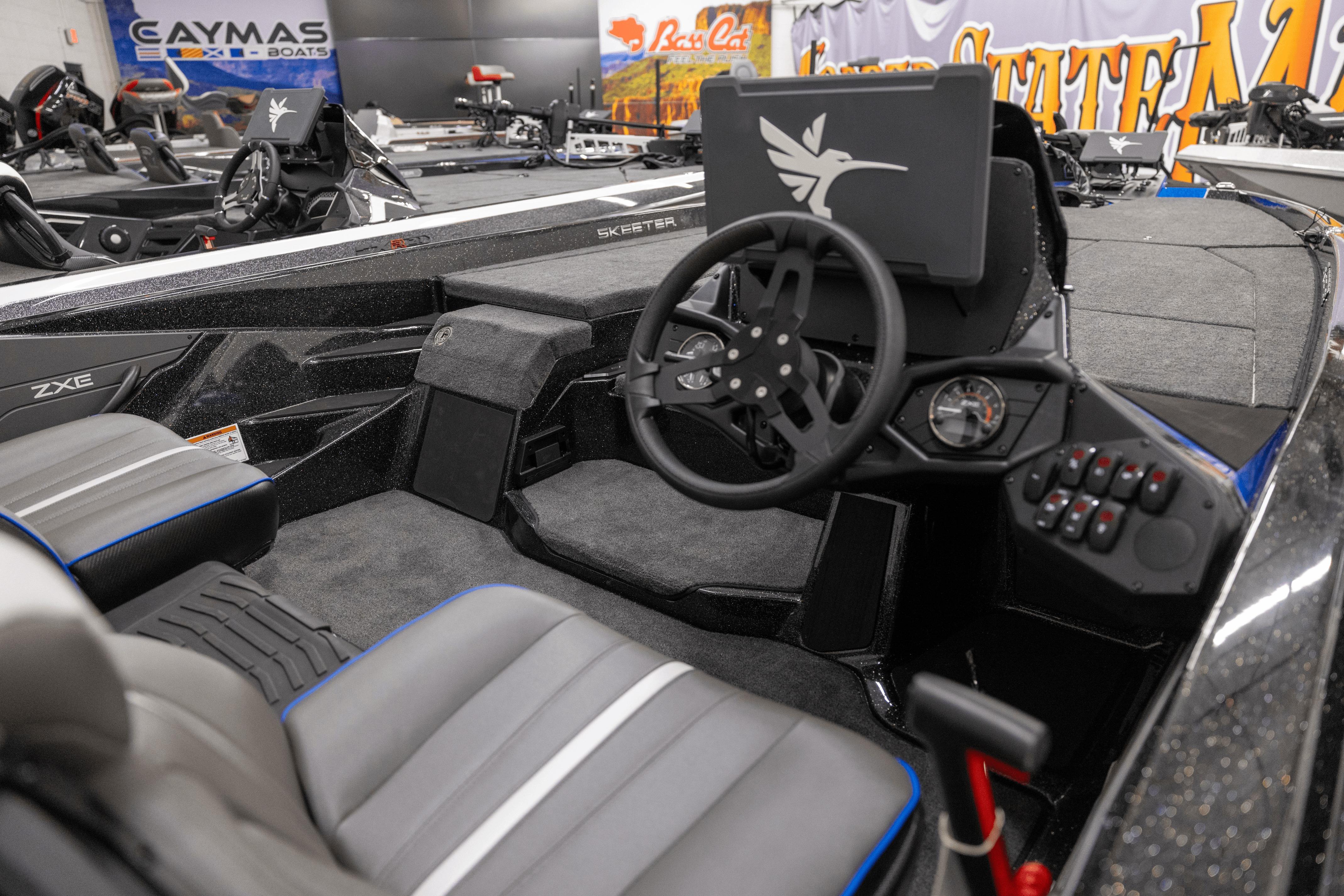 Interior of 2026 Skeeter ZXE21 boat, featuring modern steering and control panel.