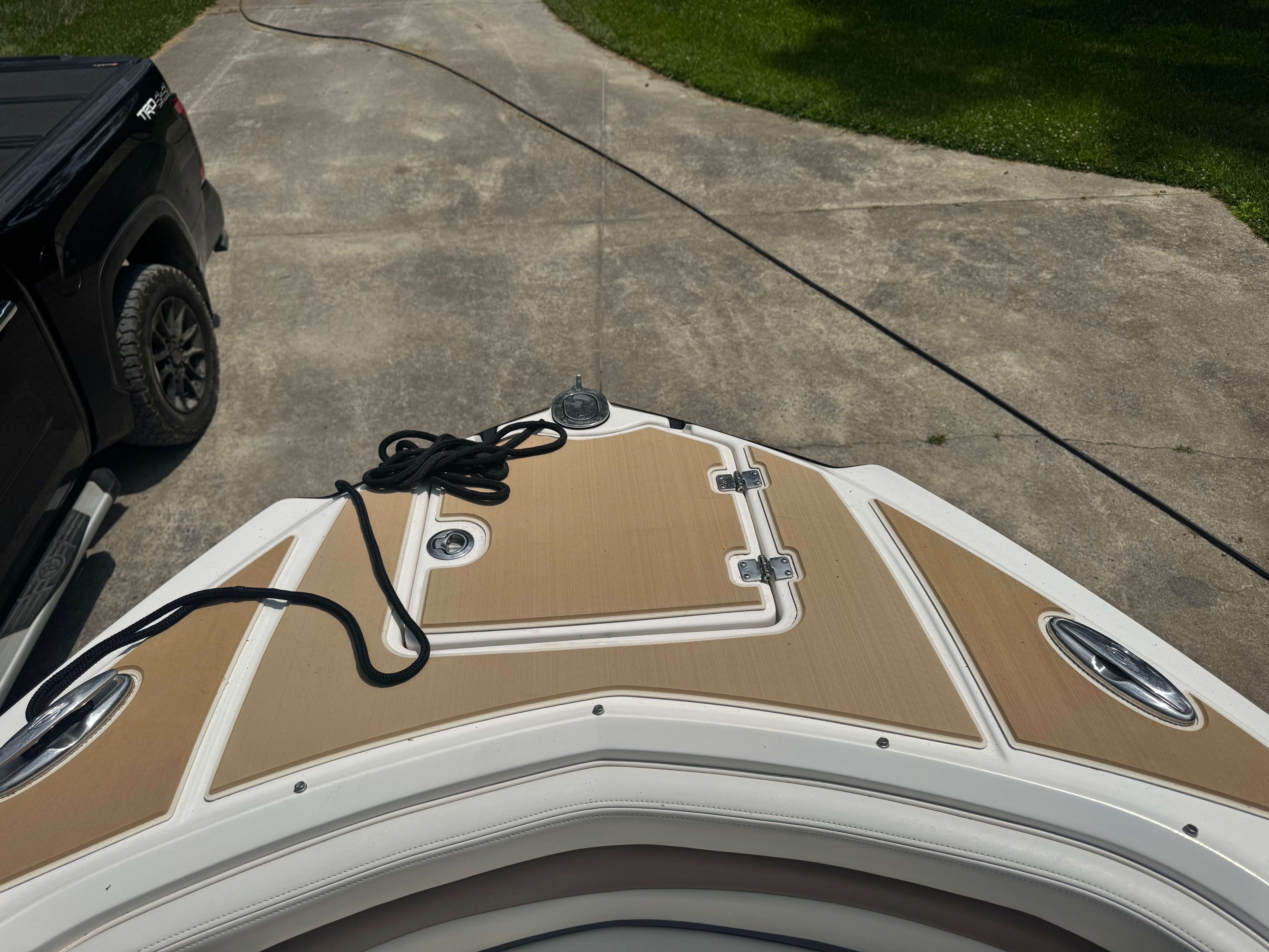 Chaparral 246 SSi boat on a driveway, 2016 model.