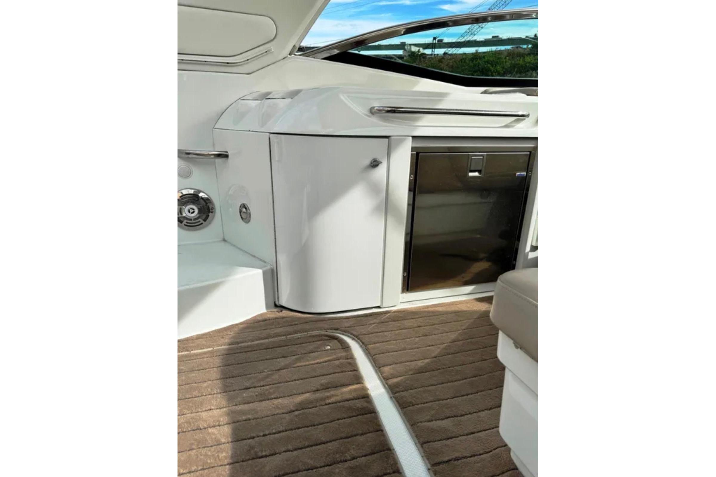 Interior of 2010 Formula 310 Sun Sport boat with sleek cabinetry and seating.