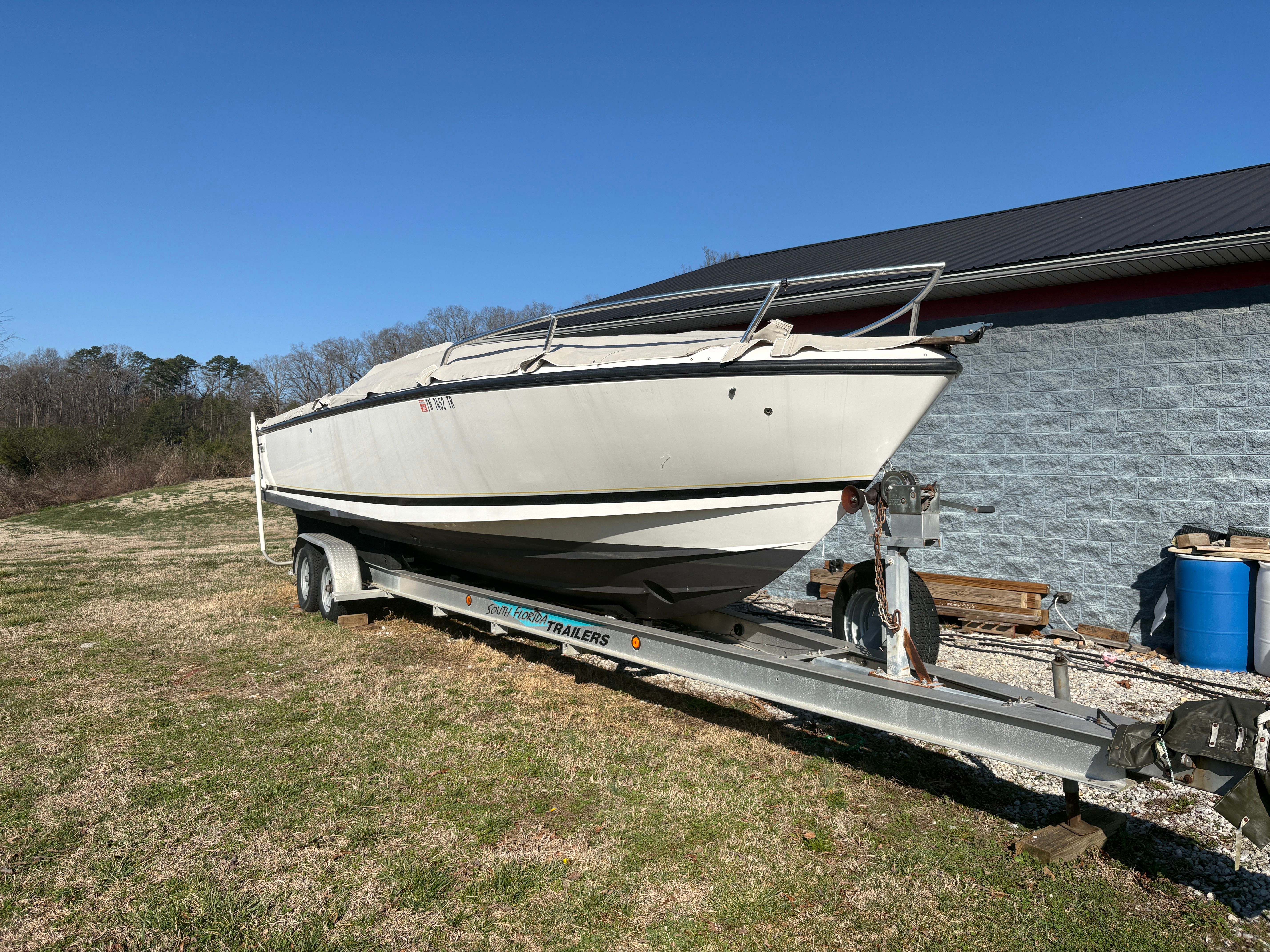 Intrepid 322 Cuddy Center Console boat on trailer, year 2002.