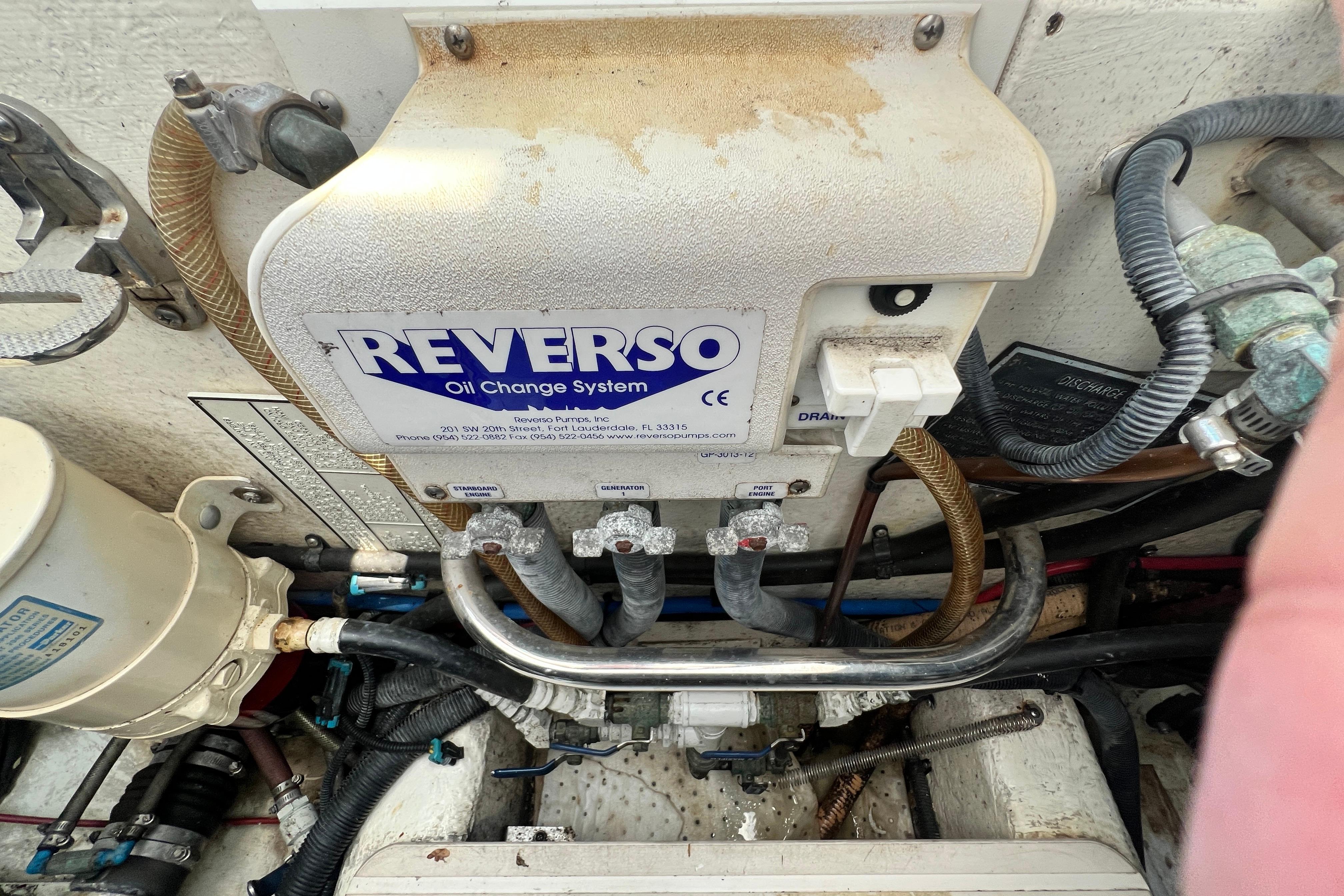 Reverso oil change system in 2007 Riviera 33 Flybridge engine compartment.