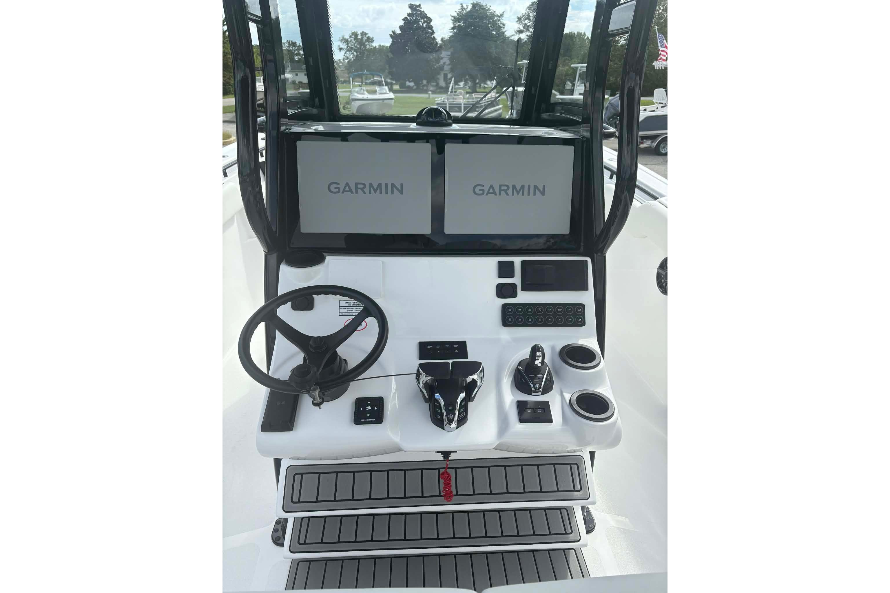 2026 Tidewater 282 CC Adventure boat dashboard with Garmin displays and steering wheel.