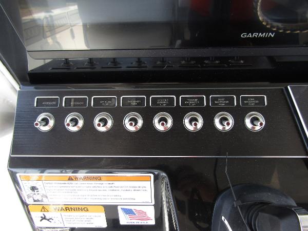 Control panel of 2024 Wellcraft 352 Fisherman boat with Garmin display.