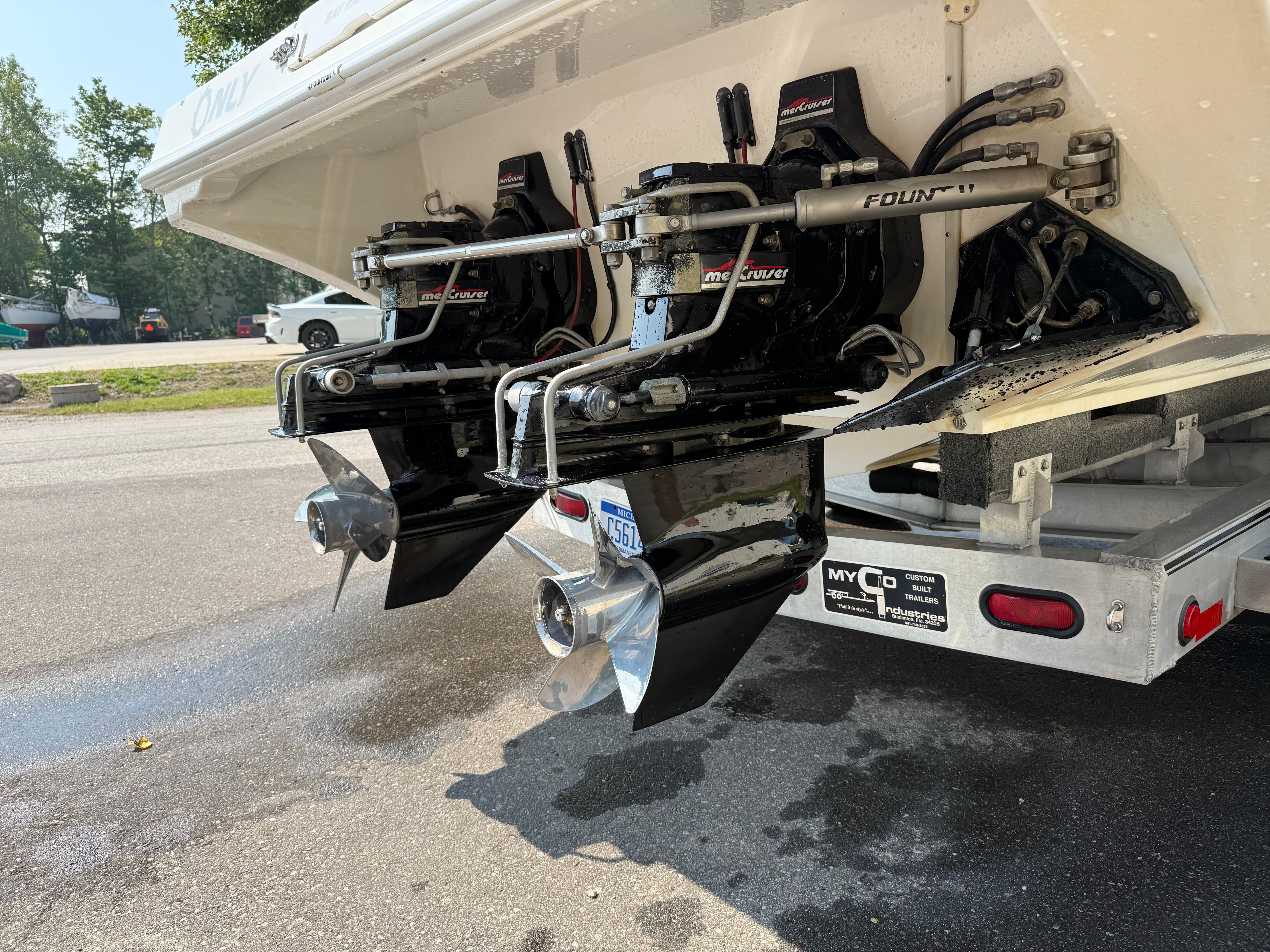 Rear view of a 1999 Fountain 32 Sport Fish Cruiser with dual engines.