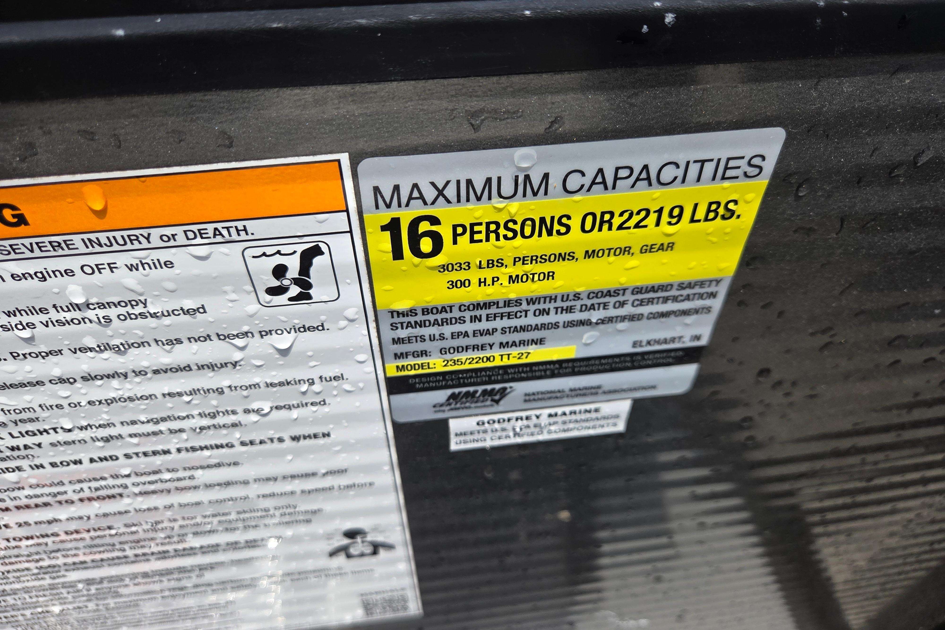 Capacity label on 2020 Godfrey AquaPatio 235 UL, max 16 persons or 2219 lbs.