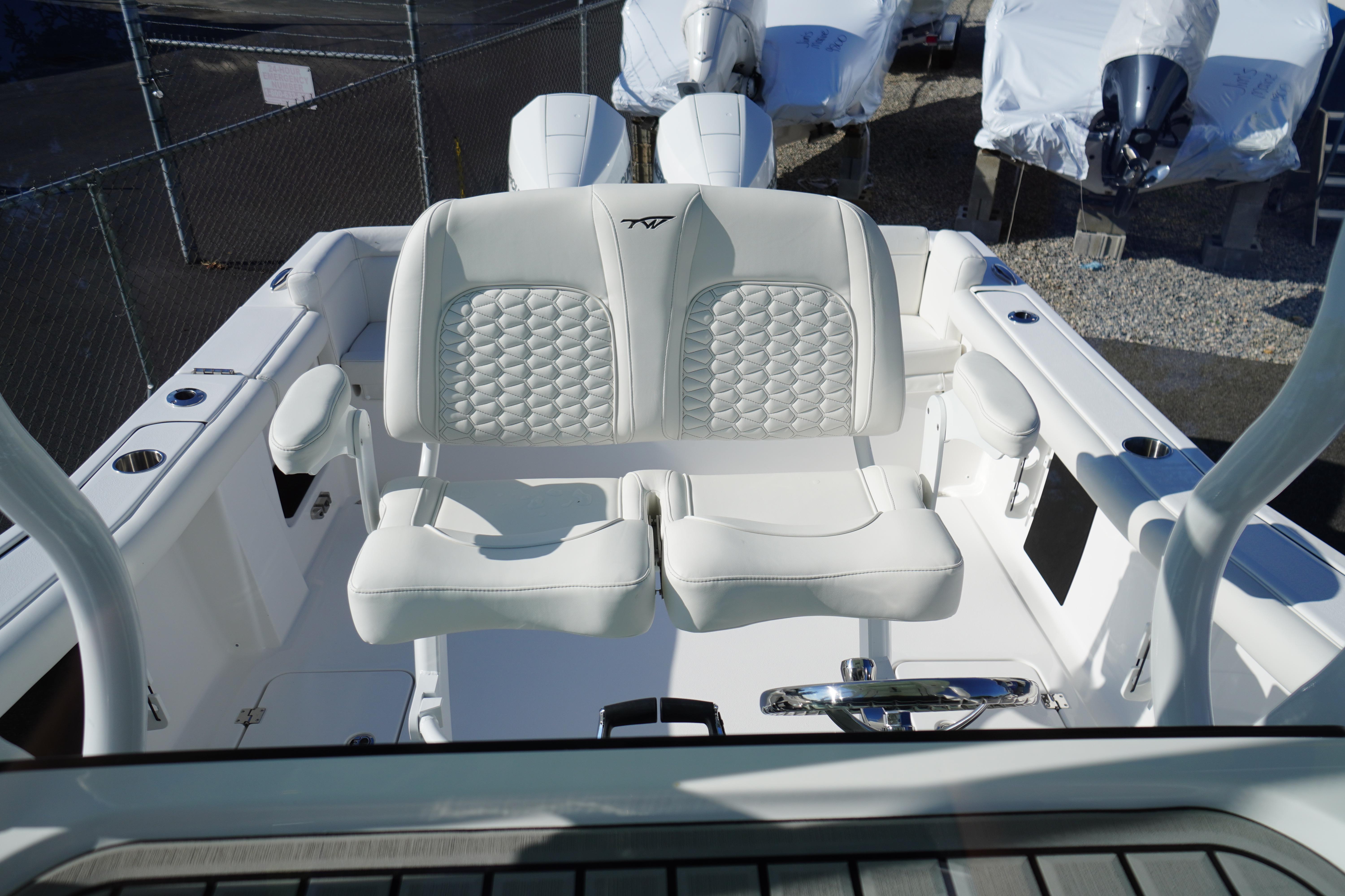 2026 Tidewater 272 LXF boat interior with luxurious white seating and modern design.