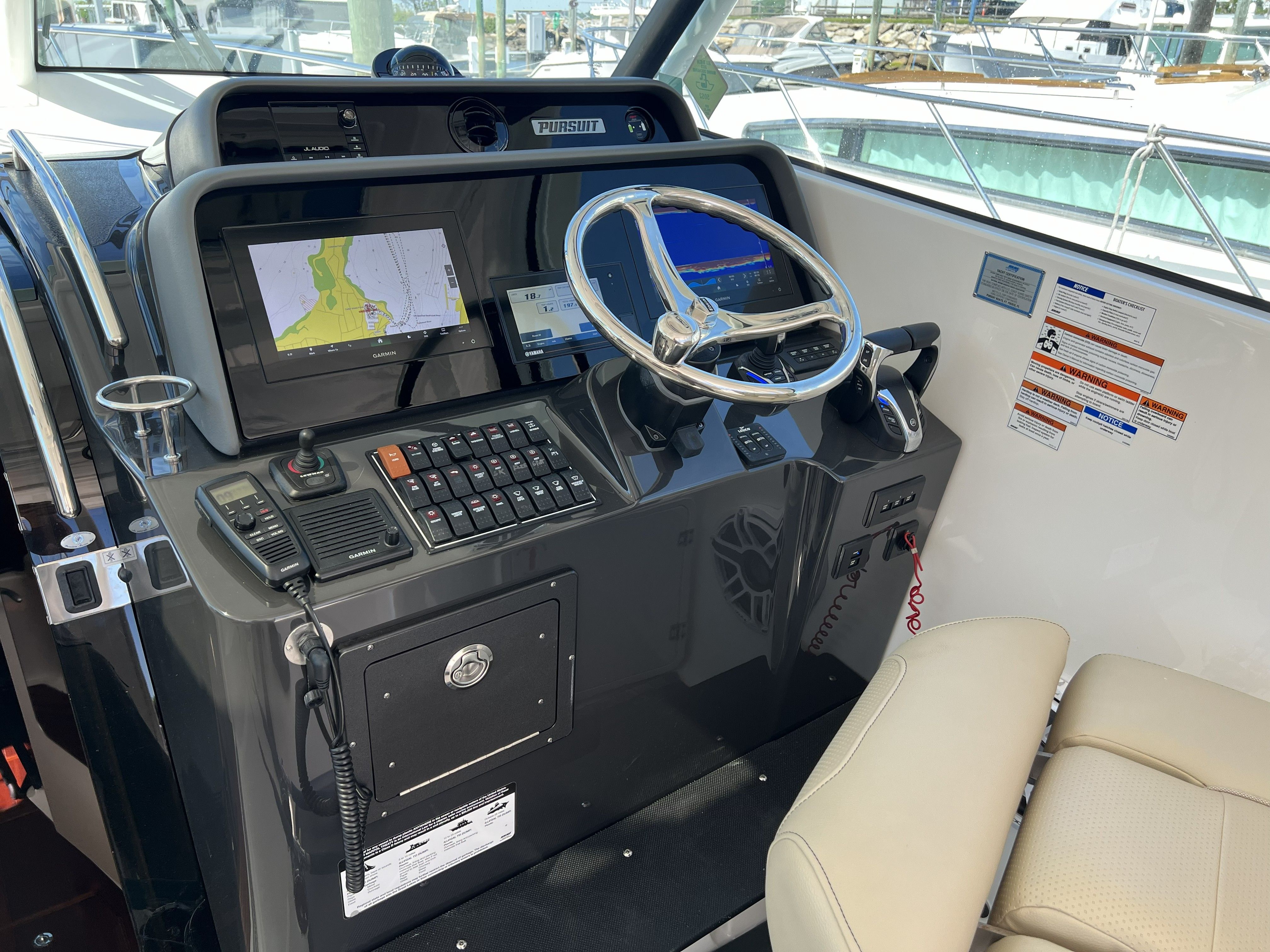 2021 Pursuit OS 385 Offshore helm with navigation system.