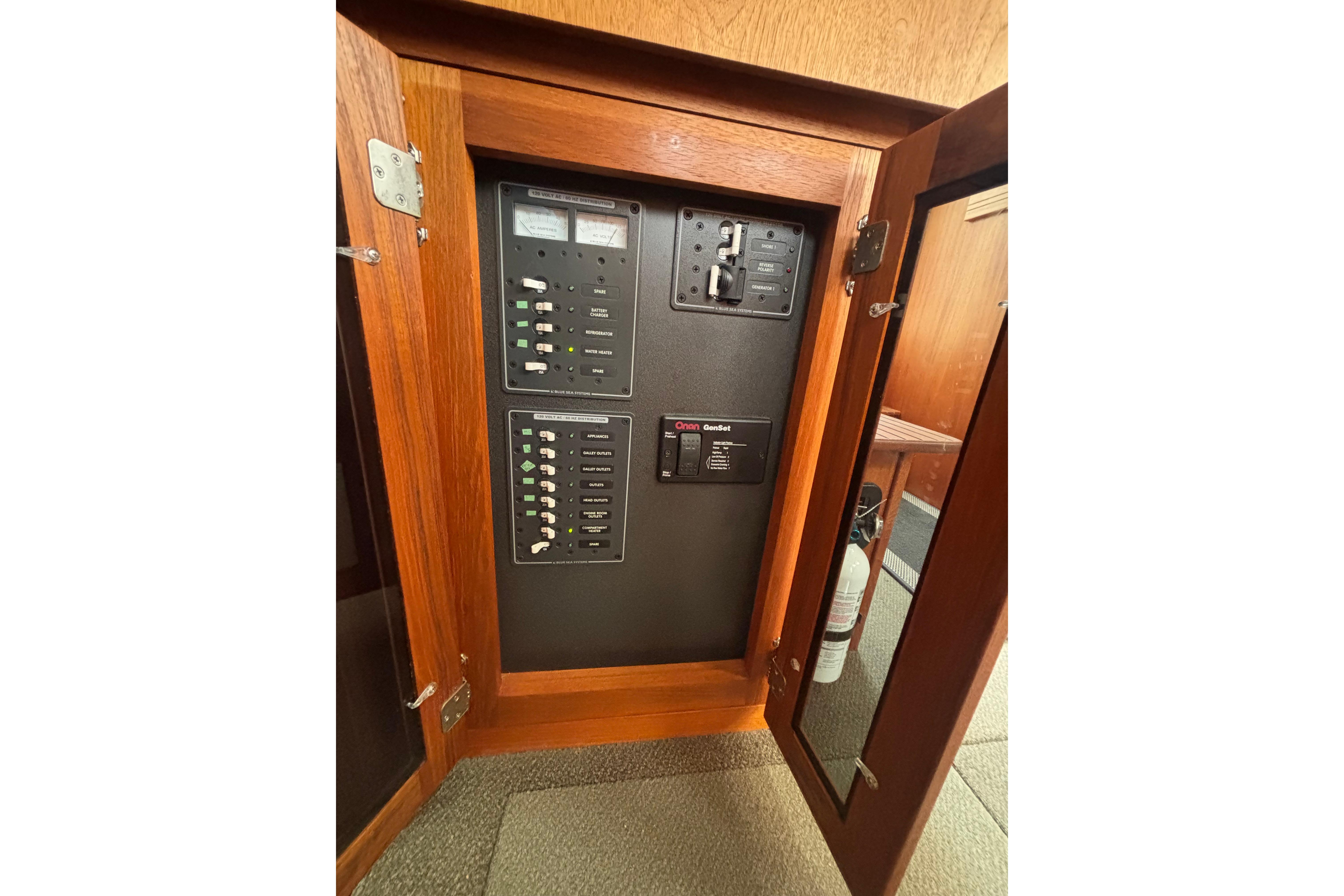 Electrical panel inside a 2004 Nordic Tug 37 boat, featuring circuit breakers and controls.