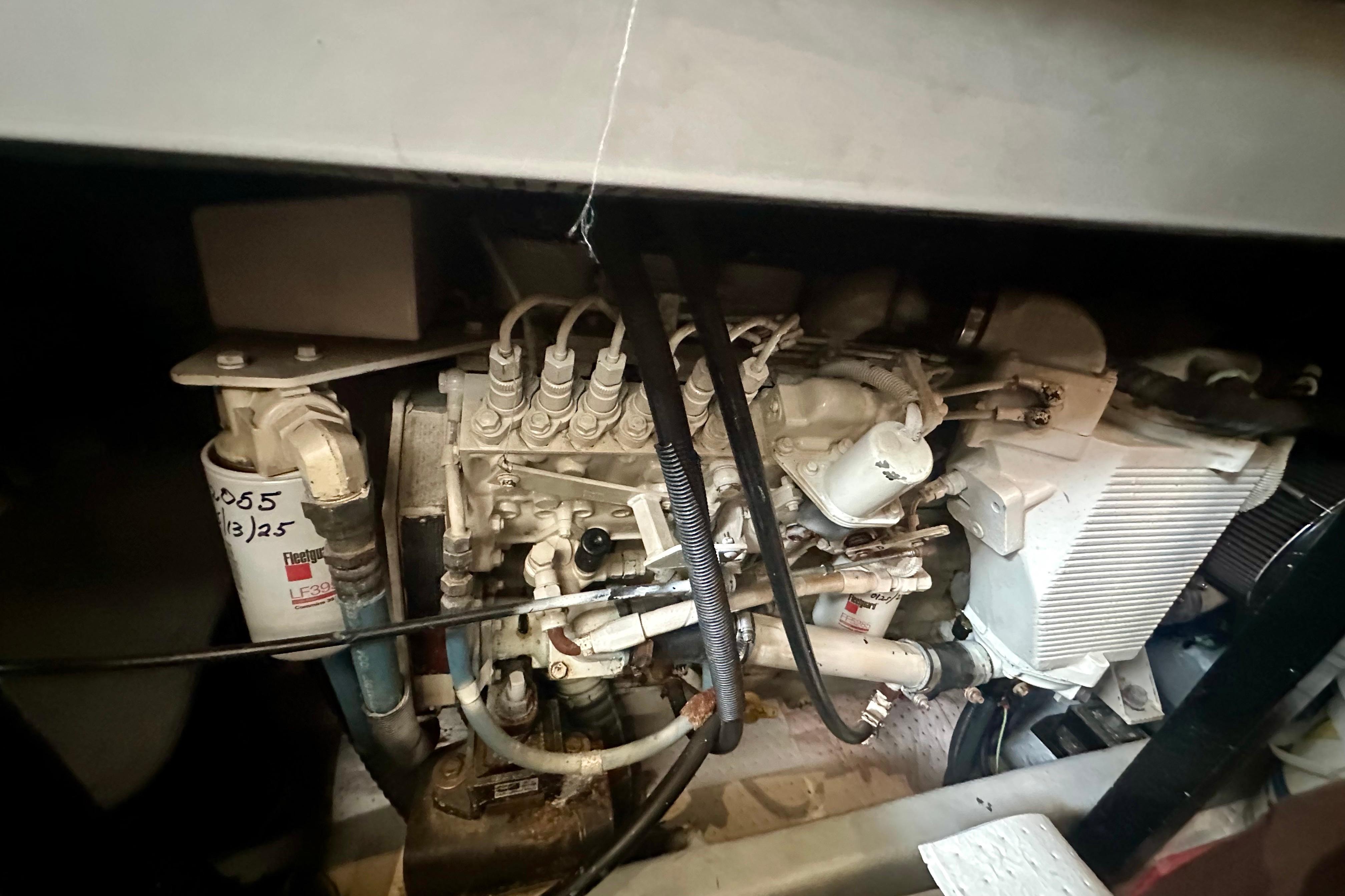 Engine compartment of a 2005 Meridian 459 Motoryacht, showcasing mechanical components.