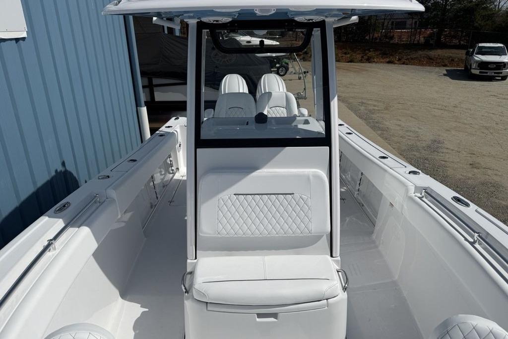 2026 Sportsman Open 252 Center Console boat with sleek white interior design.