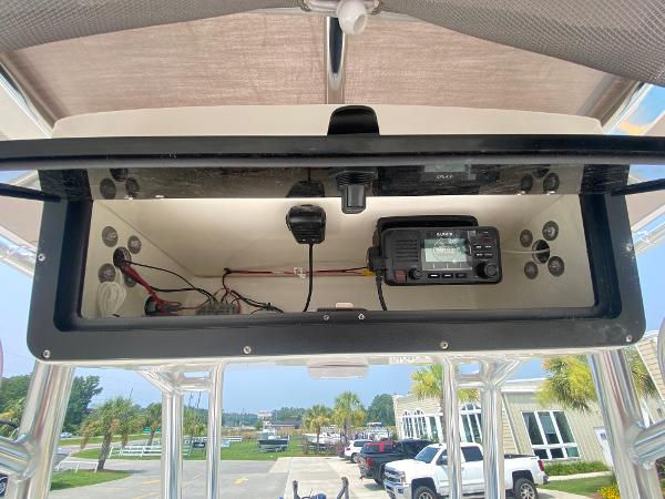 2024 Key West 203 FS boat electronics compartment with radio and wiring.