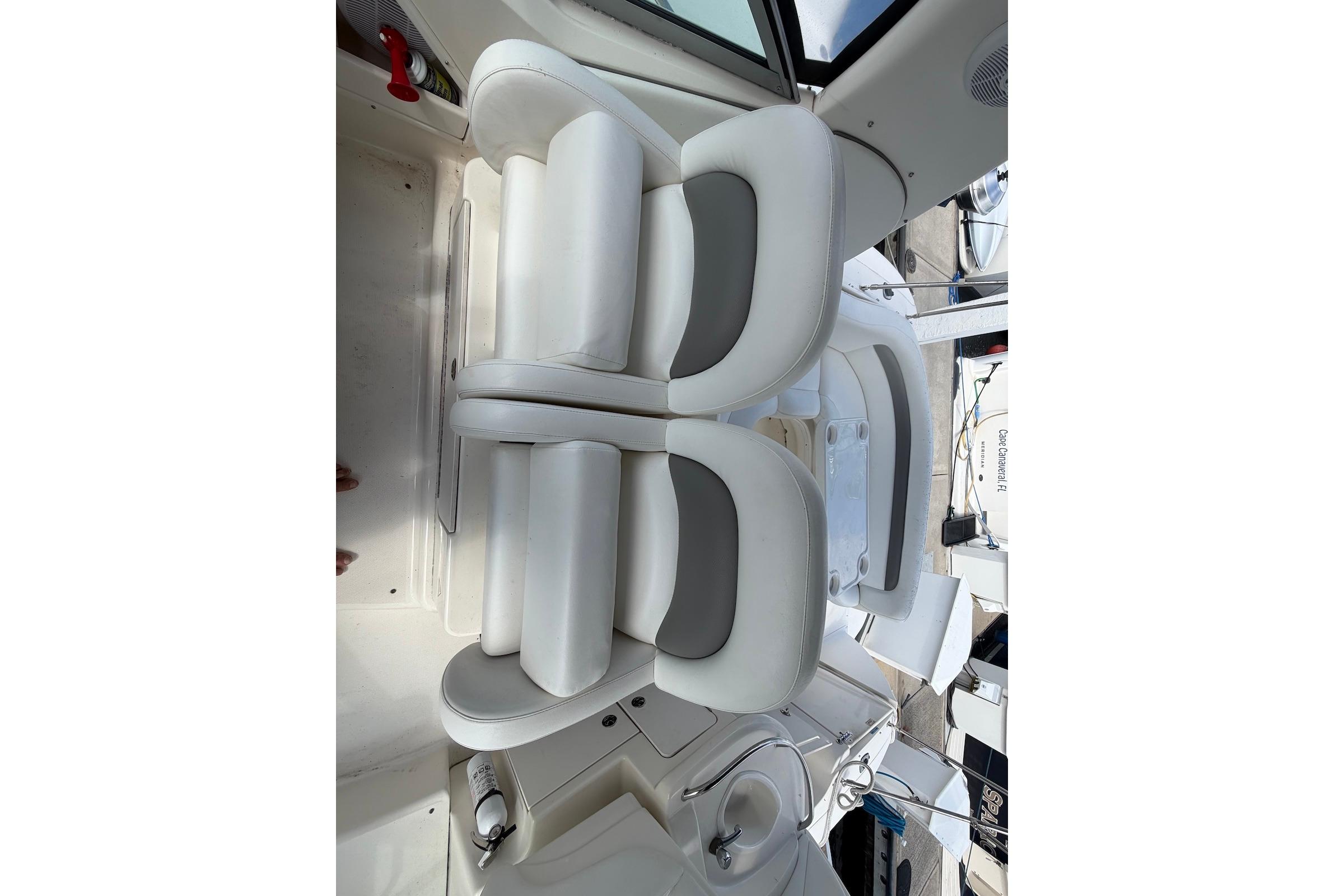 Interior of a 2003 Sea Ray 340 Sundancer boat with white seating.