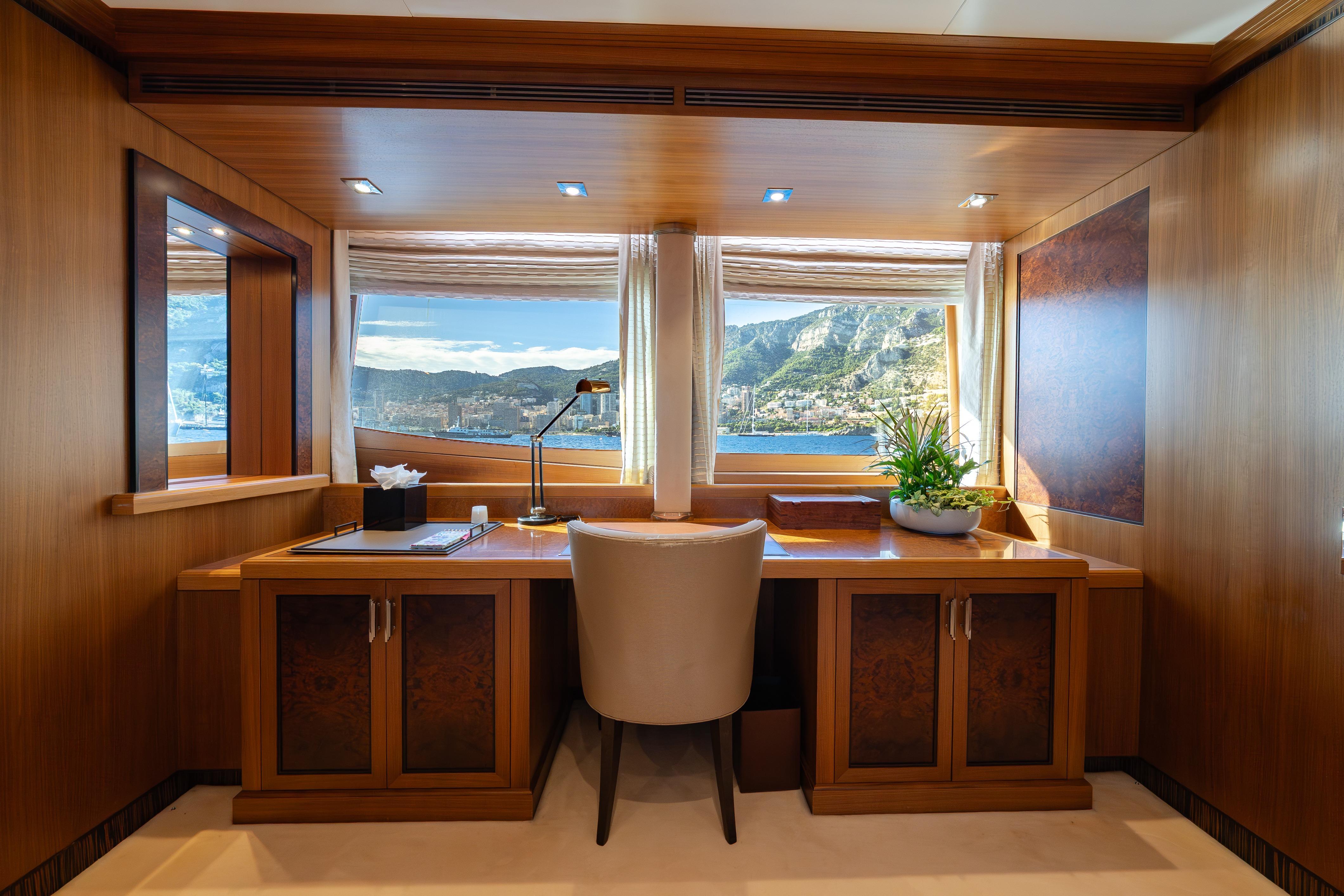Luxurious office space on 2009 Timmerman Expedition Tri-Deck yacht with scenic ocean view.