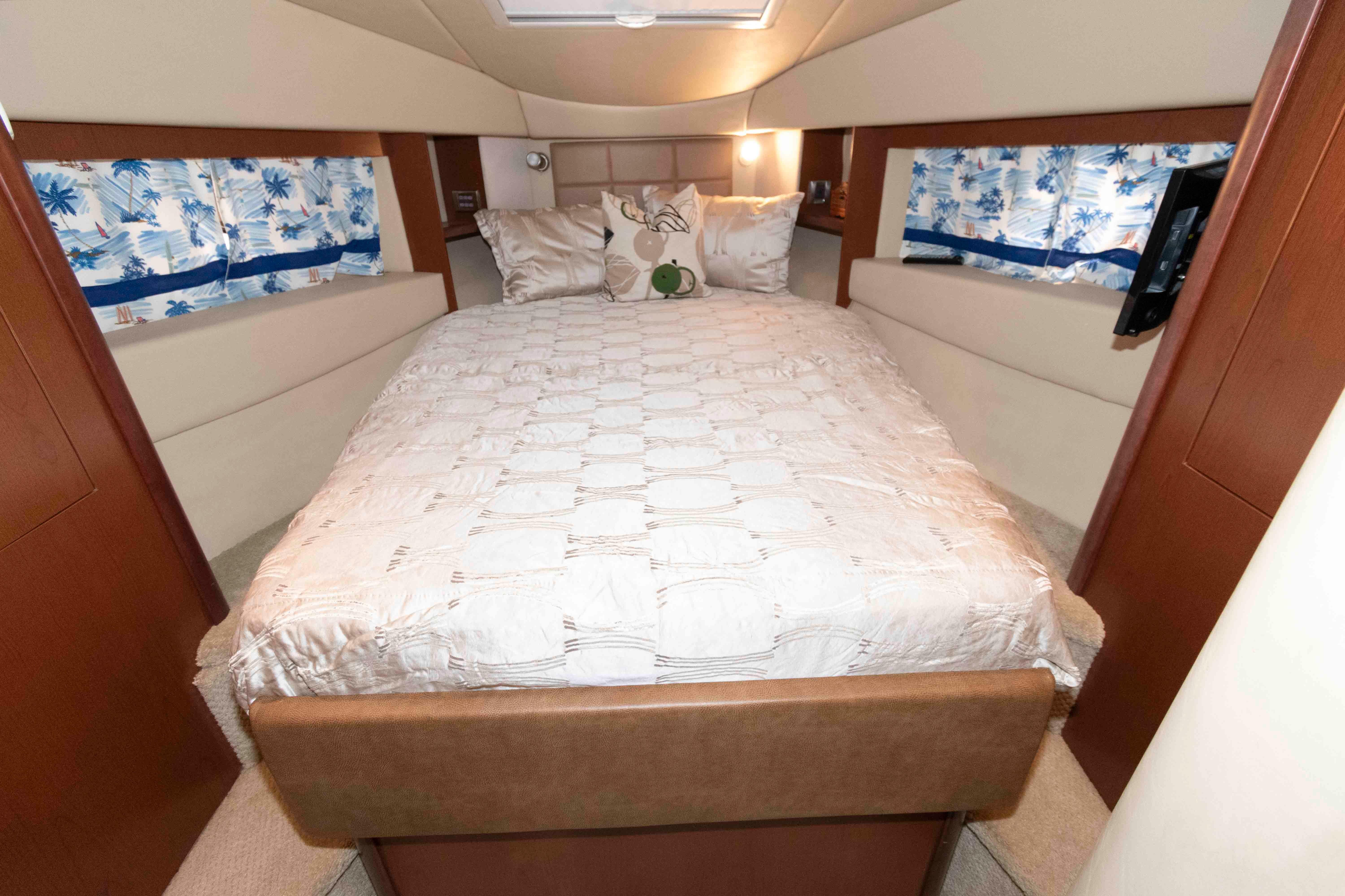 Luxurious bedroom interior of 2007 Sea Ray 36 Sedan Bridge yacht.