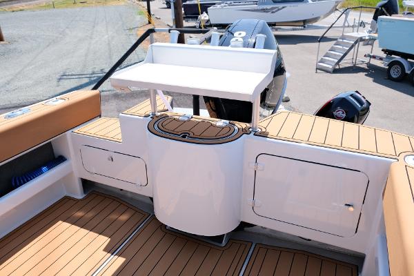 2023 Makaira Gen3 800 boat deck with storage compartments and seating.