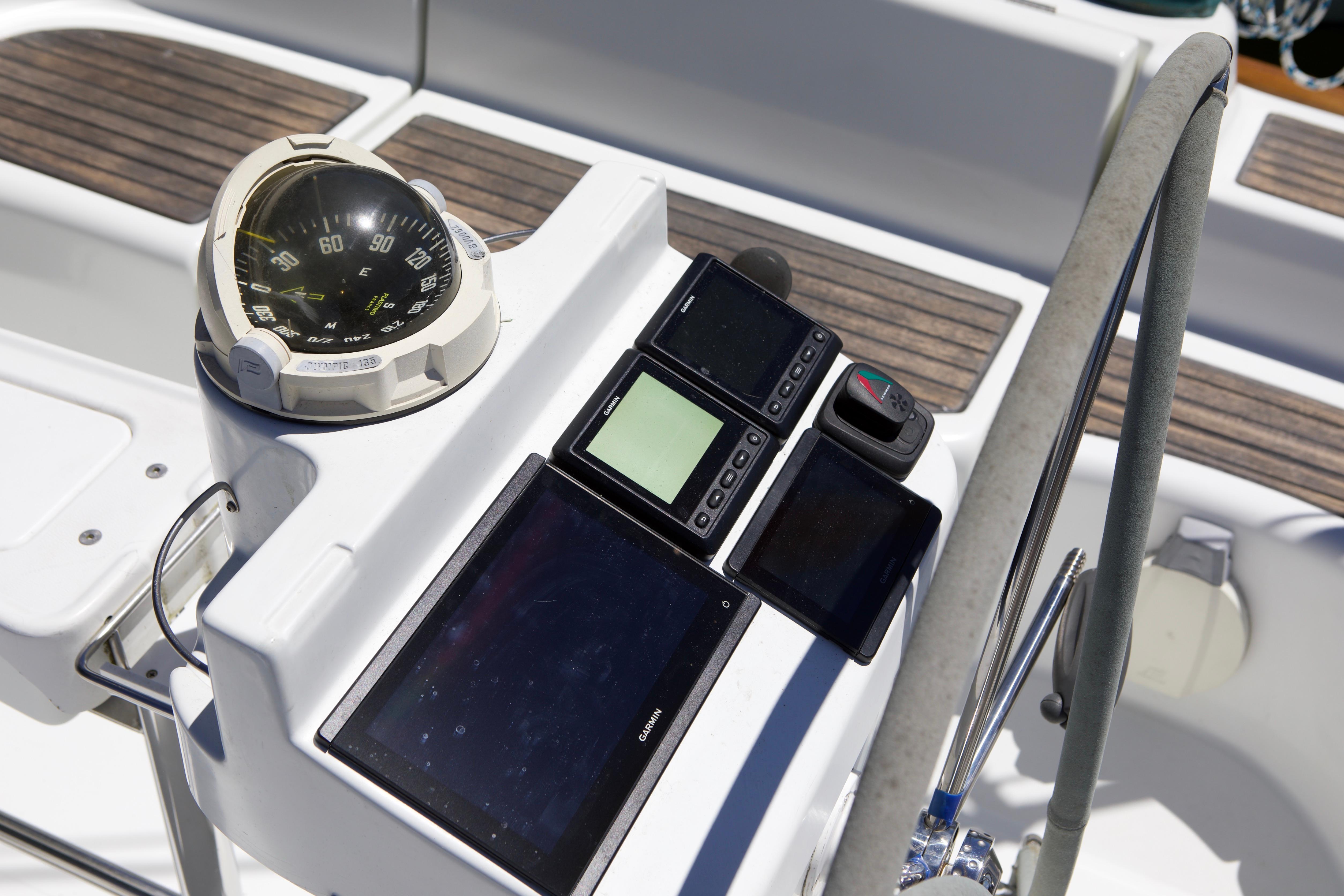 Cockpit instruments of a 2005 Beneteau 423 sailboat, featuring compass and navigation displays.