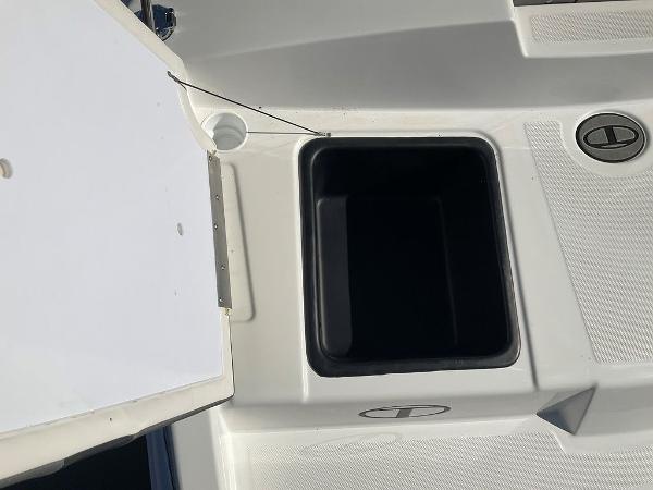 2025 Tahoe T18 boat storage compartment with open lid, showcasing interior space.