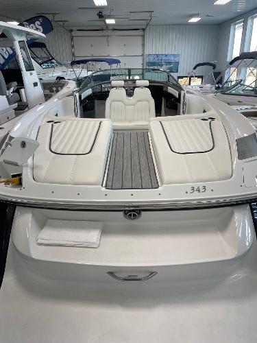 2005 Cobalt 343 boat with white seating in a showroom.