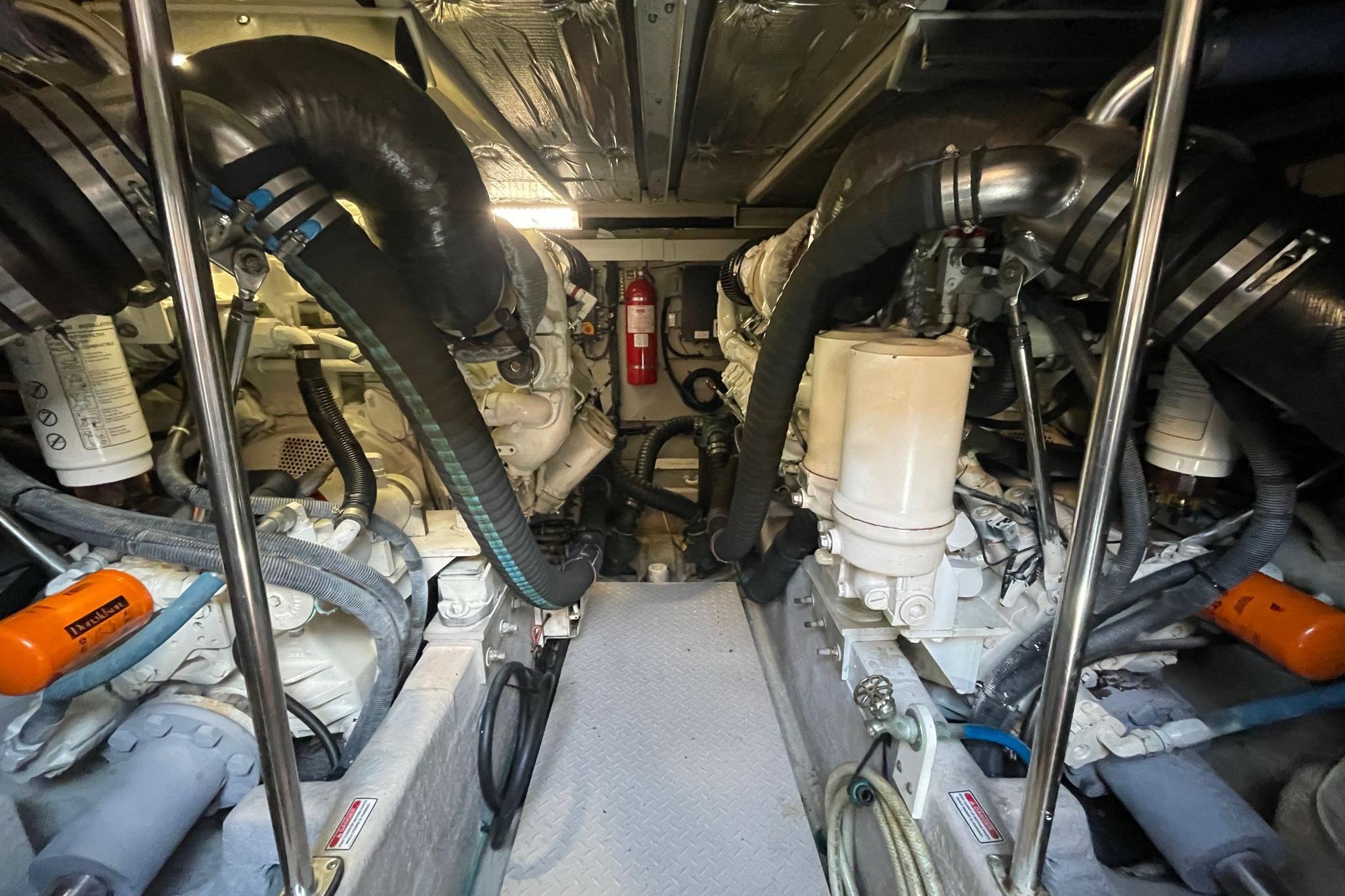 Engine room of a 2006 Sea Ray 580 Sedan Bridge yacht, showcasing mechanical components.