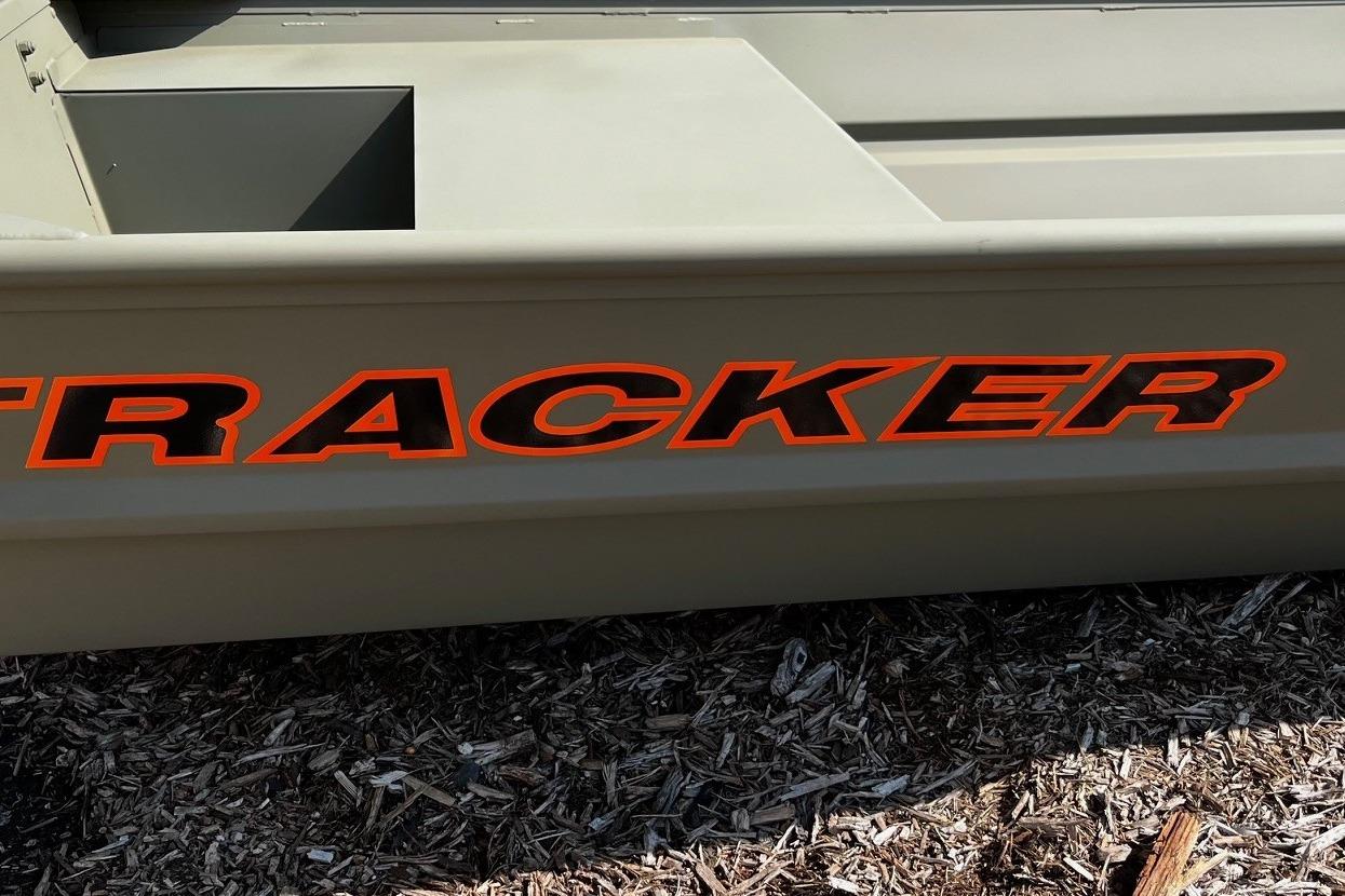 2026 Tracker Grizzly 14 Jon boat with bold orange lettering on the side.