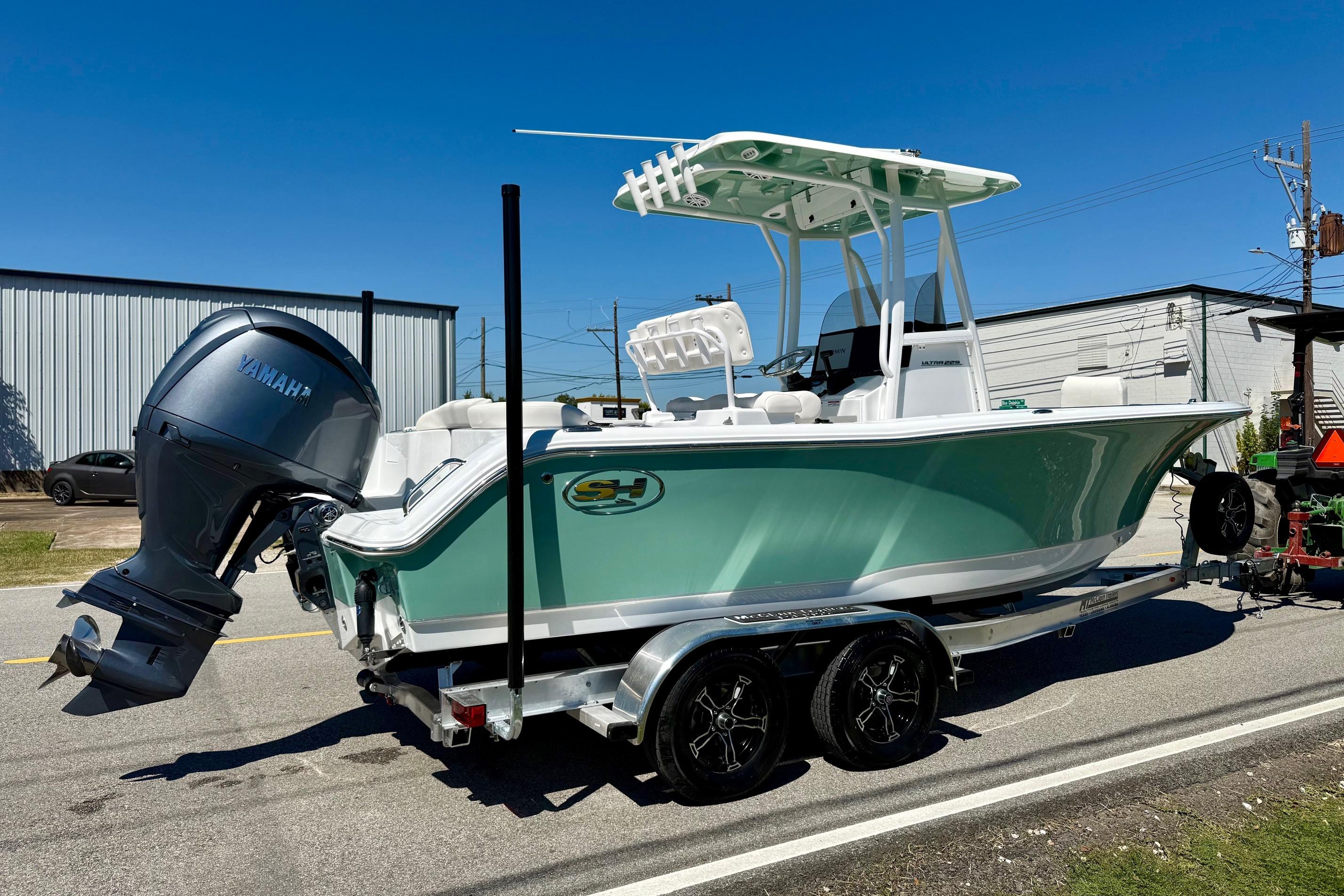 2026 Sea Hunt Ultra 229 boat on trailer with Yamaha outboard motor.