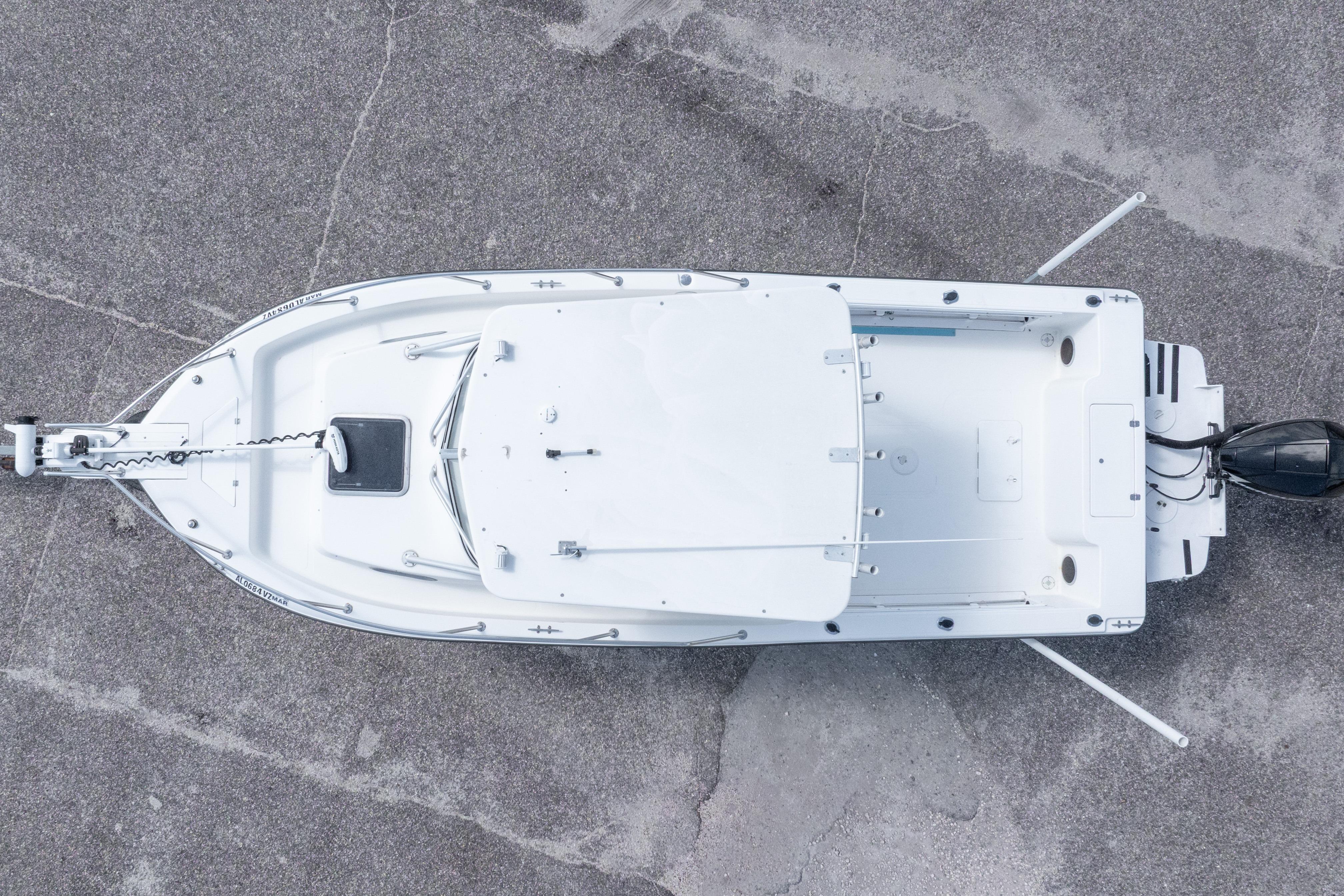 Aerial view of 2007 Sea Boss 235 Walkaround boat on concrete surface.