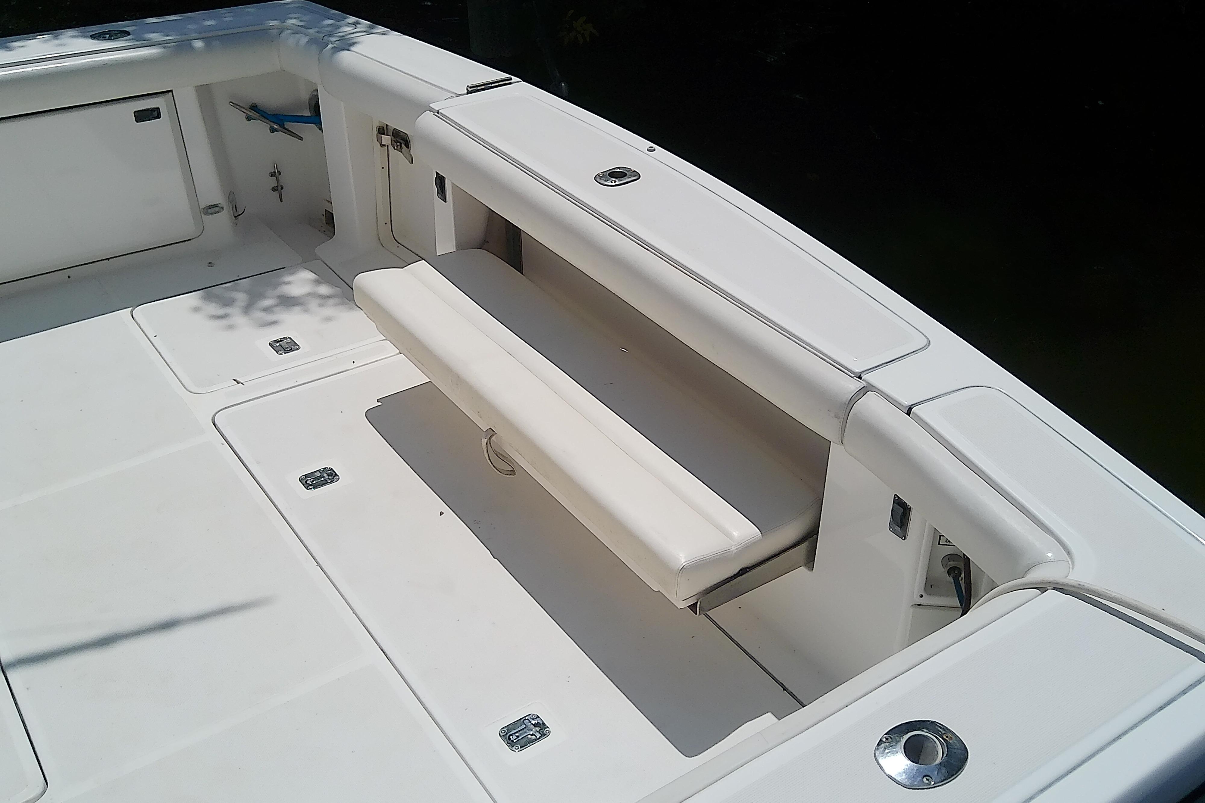 2000 Tiara Yachts 4100 Open boat deck with foldable seating and storage compartments.