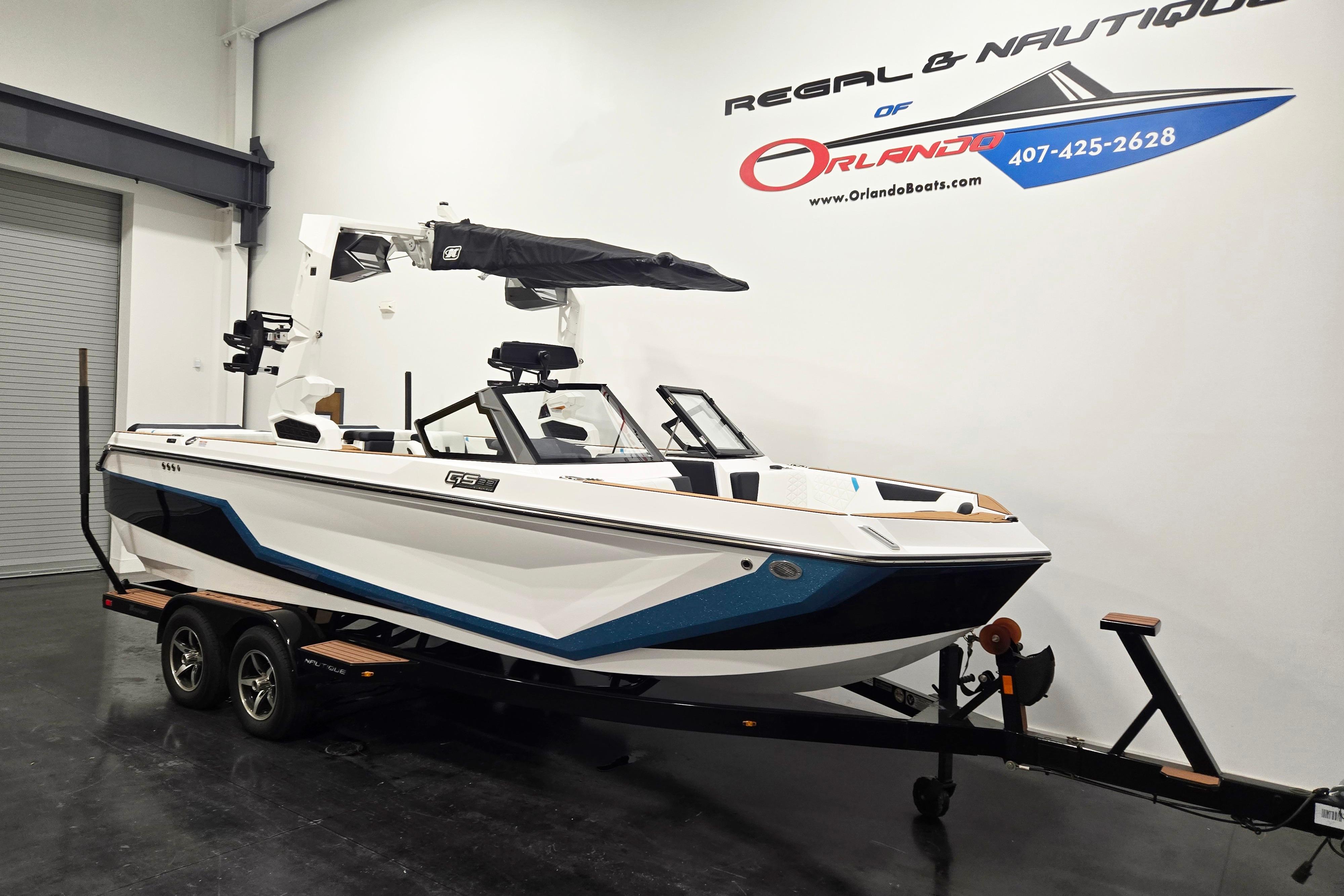 2026 Nautique Super Air Nautique GS22 boat on trailer in showroom.
