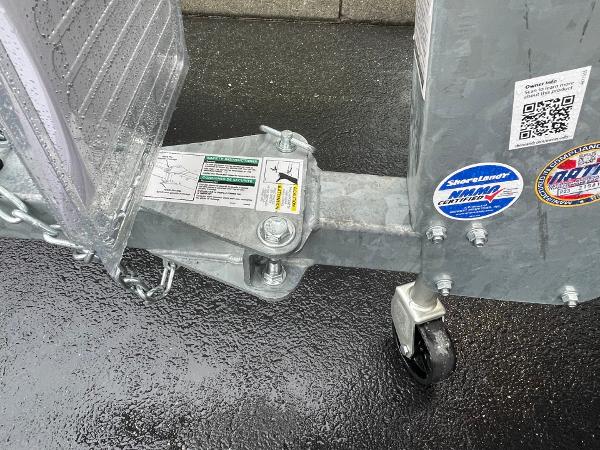 Trailer hitch of 2021 Crestliner 1650 Fish Hawk SC on wet pavement.