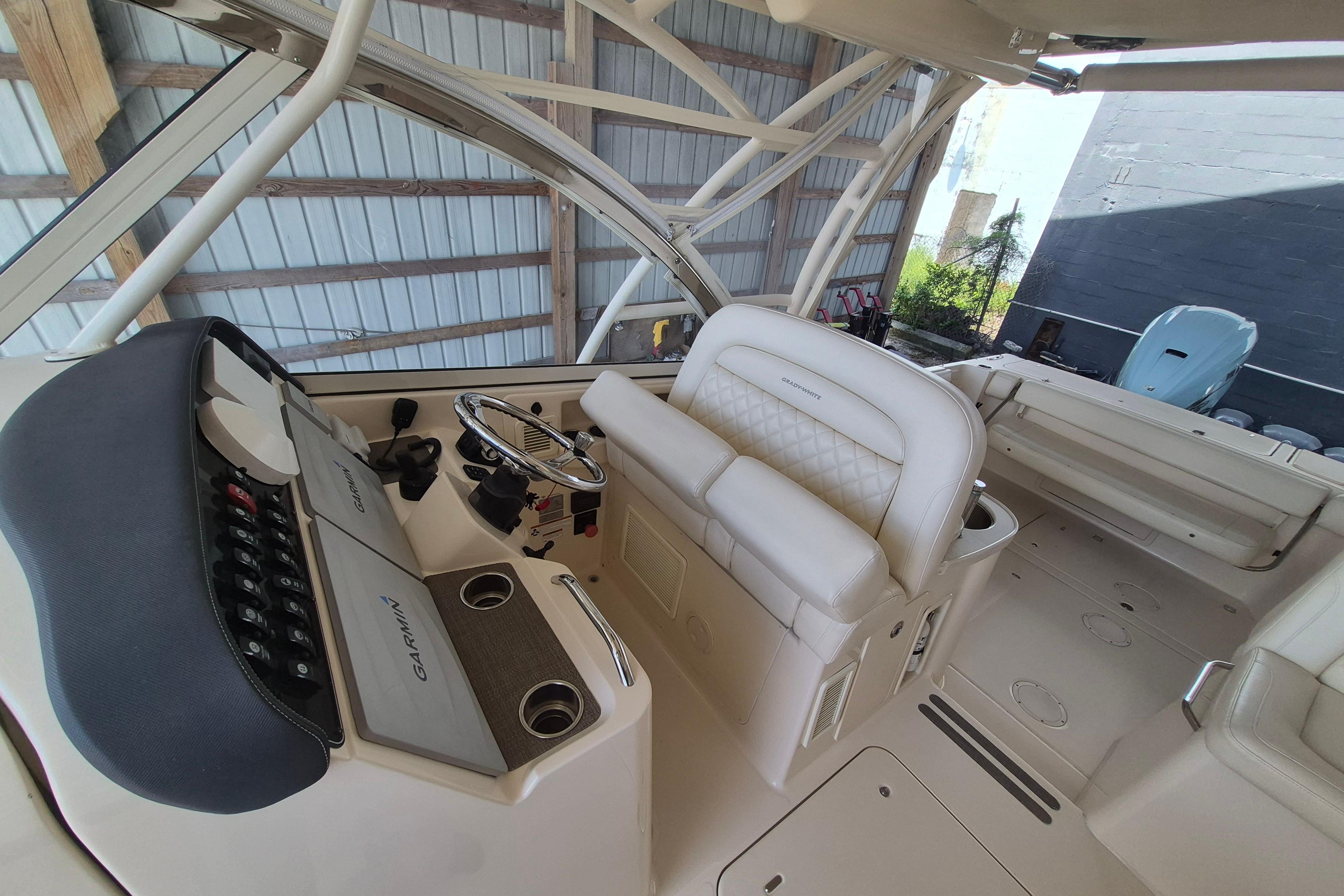 2019 Grady-White Freedom 335 boat interior with helm and seating area.