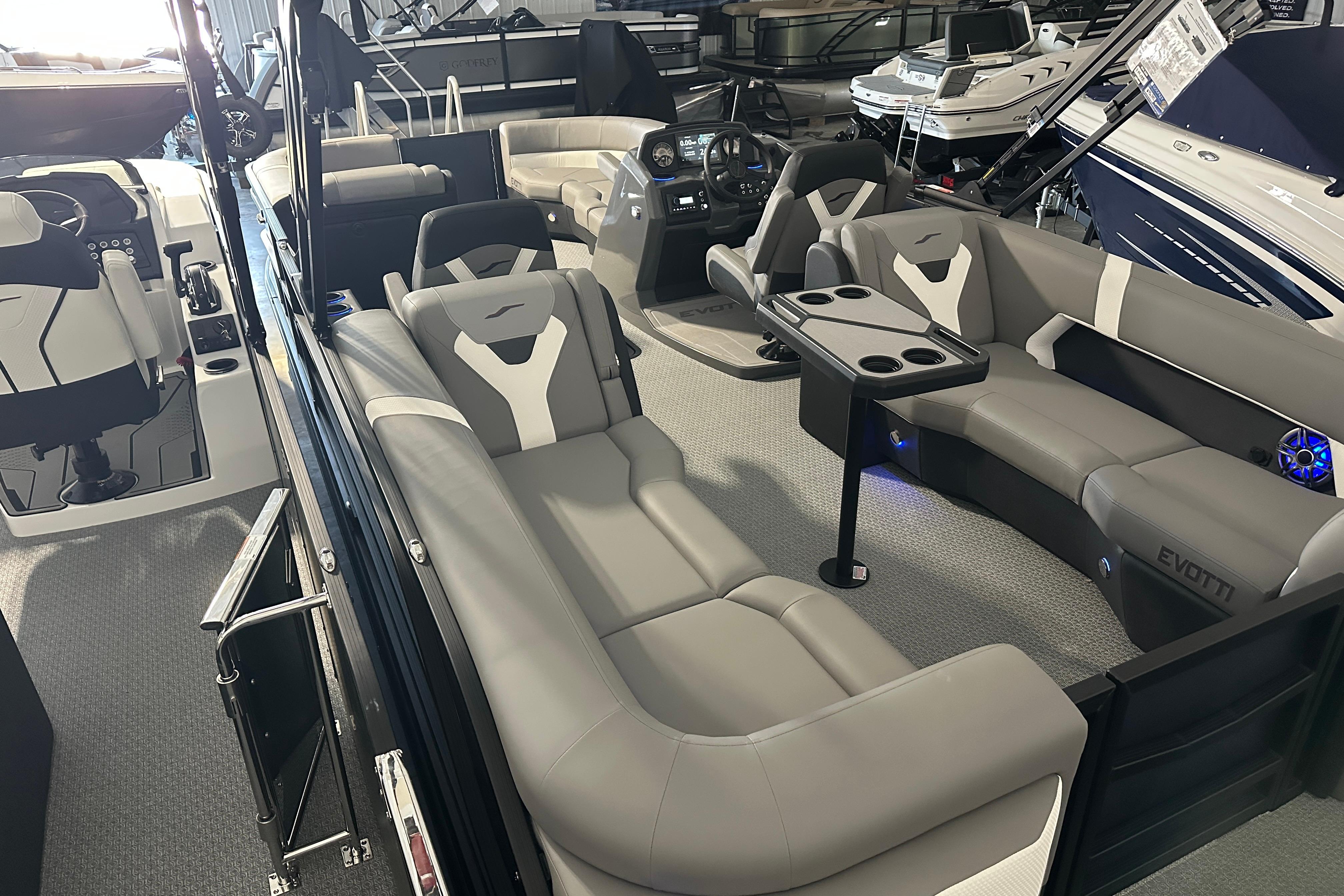 Luxurious interior of 2026 Evotti 523QL boat with plush seating and modern dashboard.