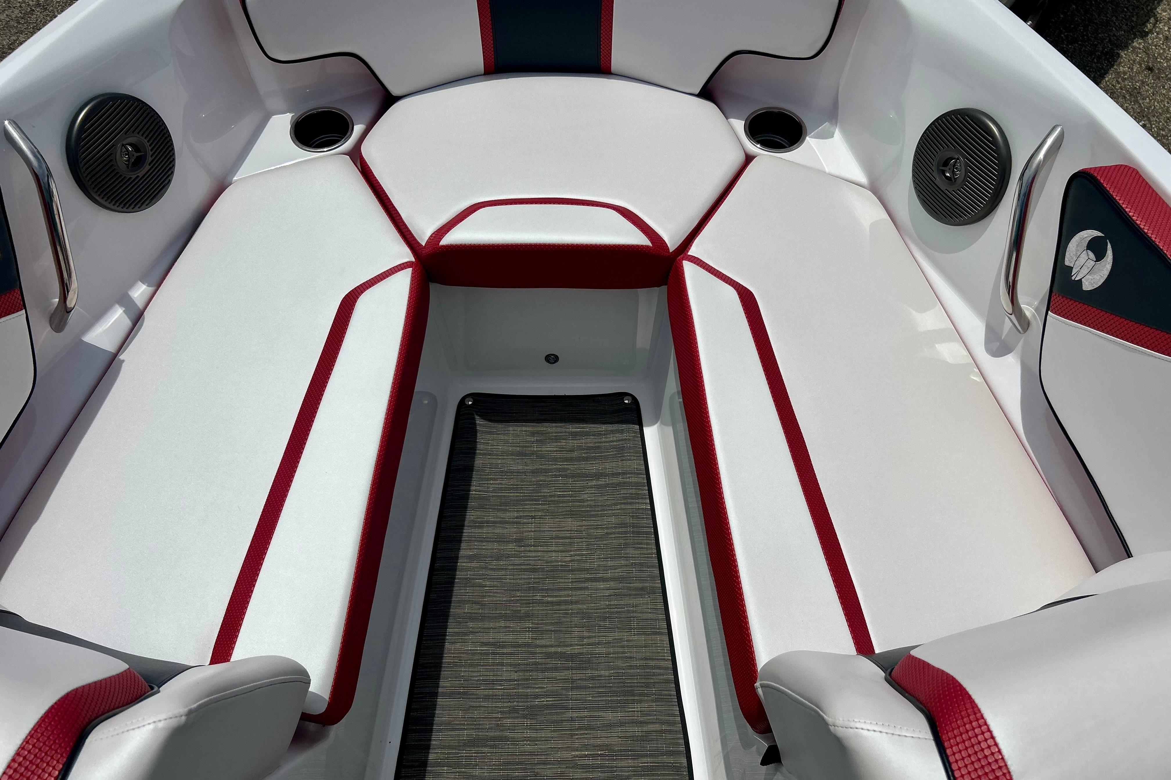 Interior seating of a 2021 Scarab 195 ID boat with red and white upholstery.