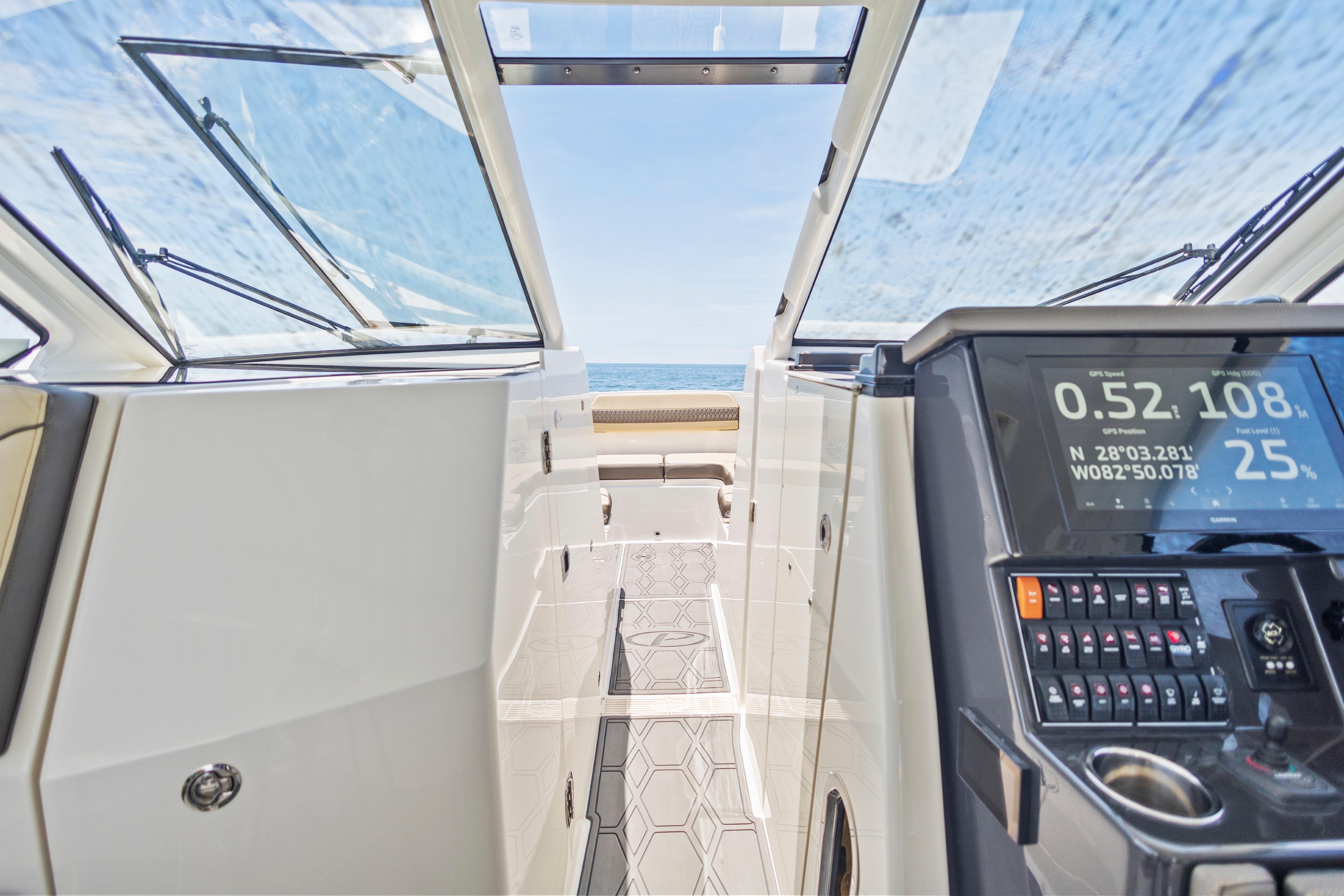 2021 Pursuit DC 365 Dual Console interior with navigation display, open sea view.