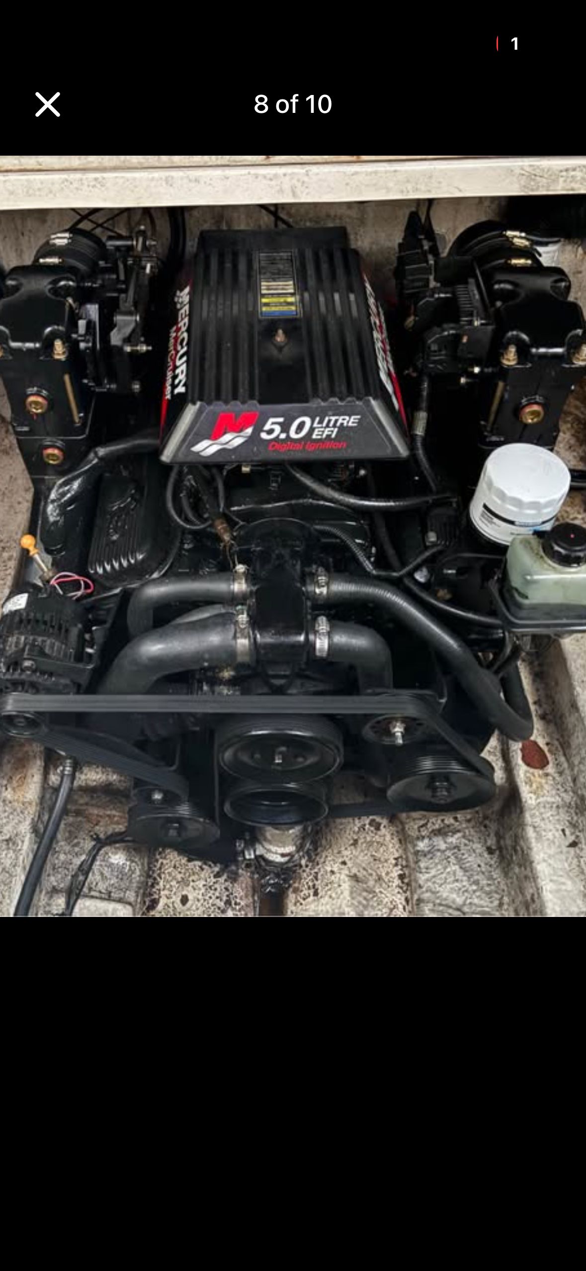 Engine compartment of a 2001 Sea Ray 240 Sundancer with a 5.0-liter engine.