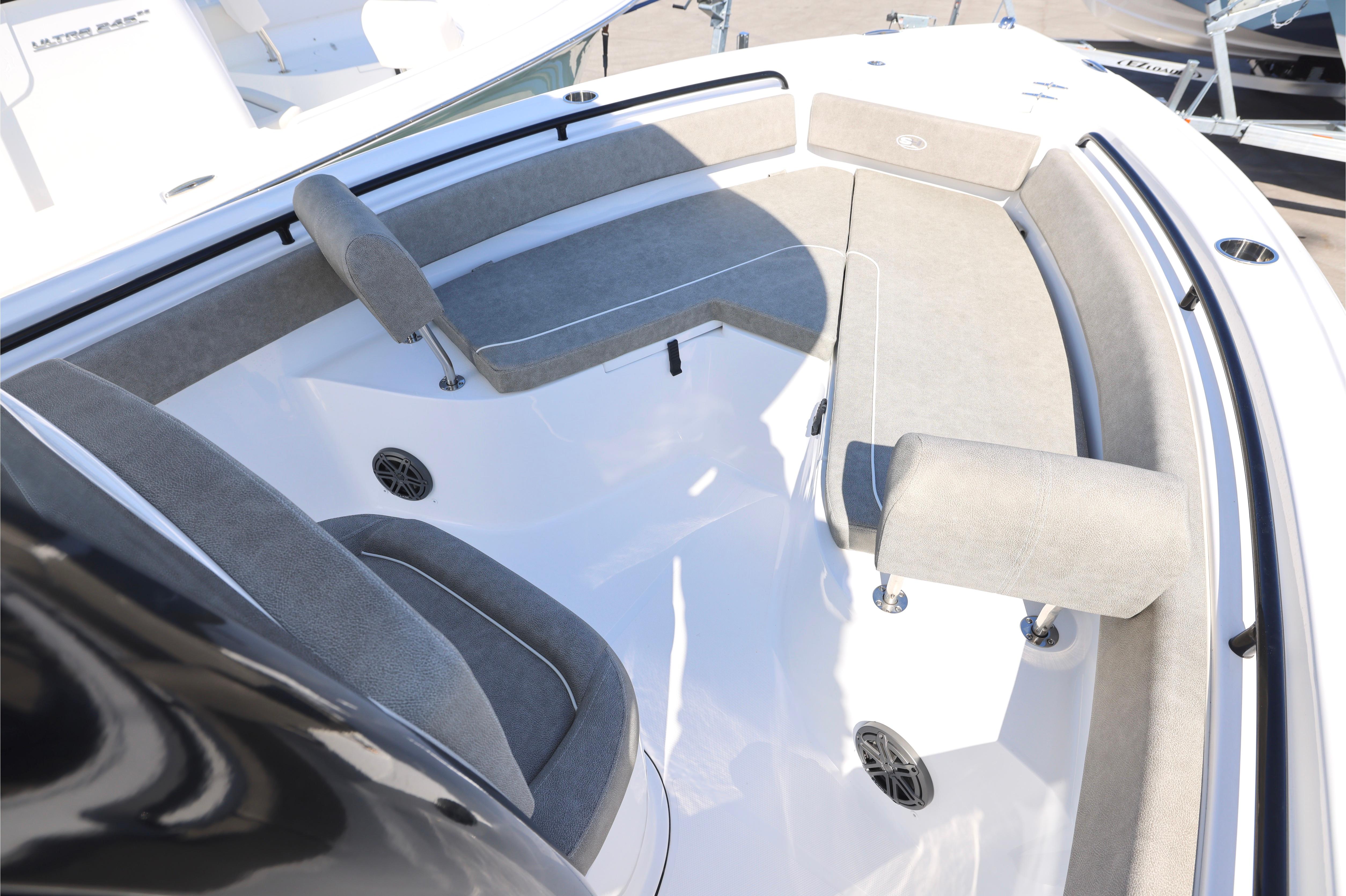 2026 Sea Hunt Ultra 245 SE boat interior with cushioned seating and speakers.