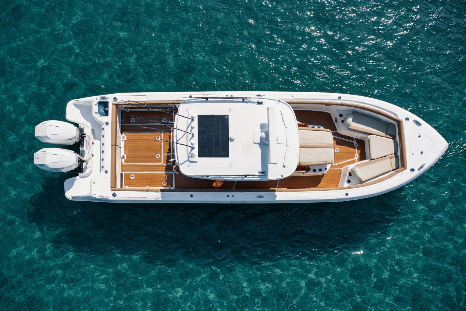 2024 Everglades 315 Center Console boat on clear blue water, aerial view.