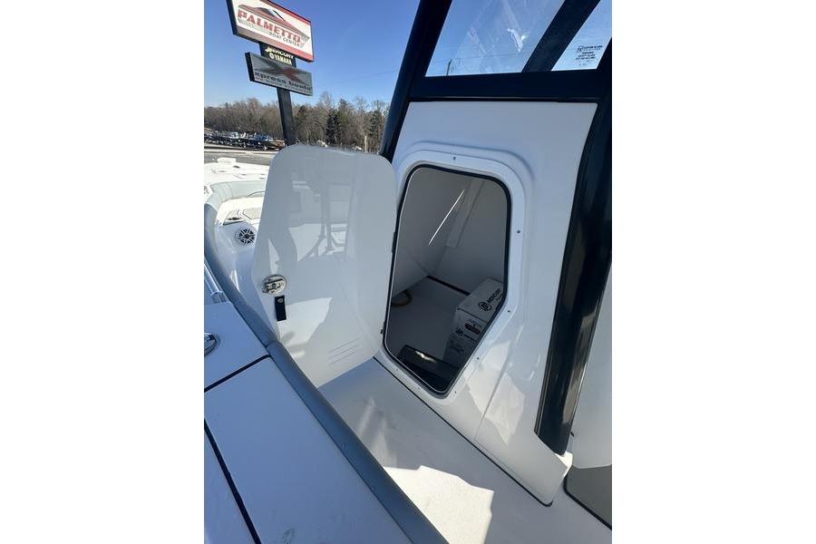 2026 Sportsman Masters 247 Bay Boat cabin entrance with open door.