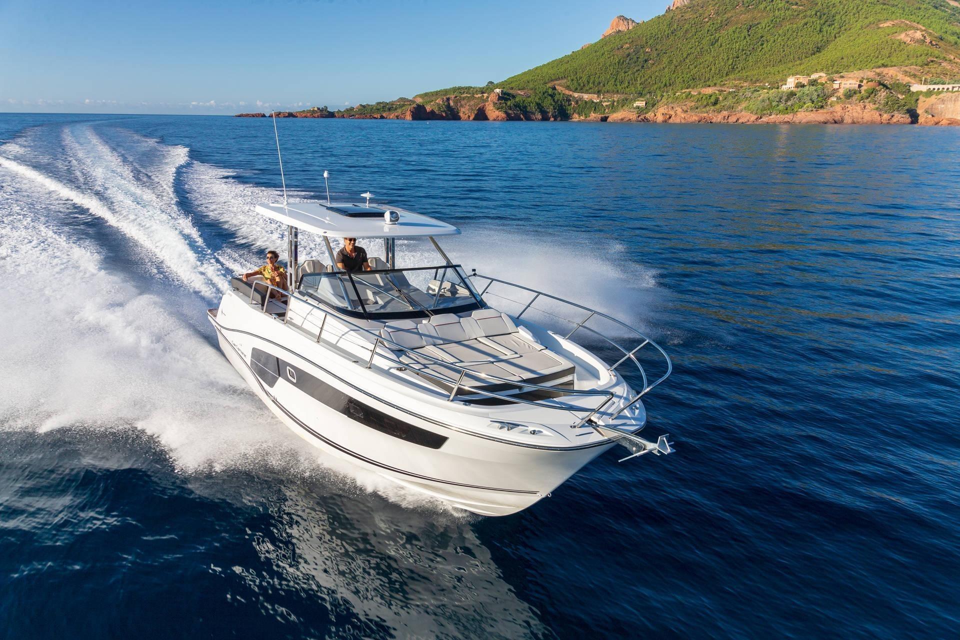 2024 Jeanneau Cap Camarat 10.5 WA Series2 cruising on open water, scenic coastal backdrop.