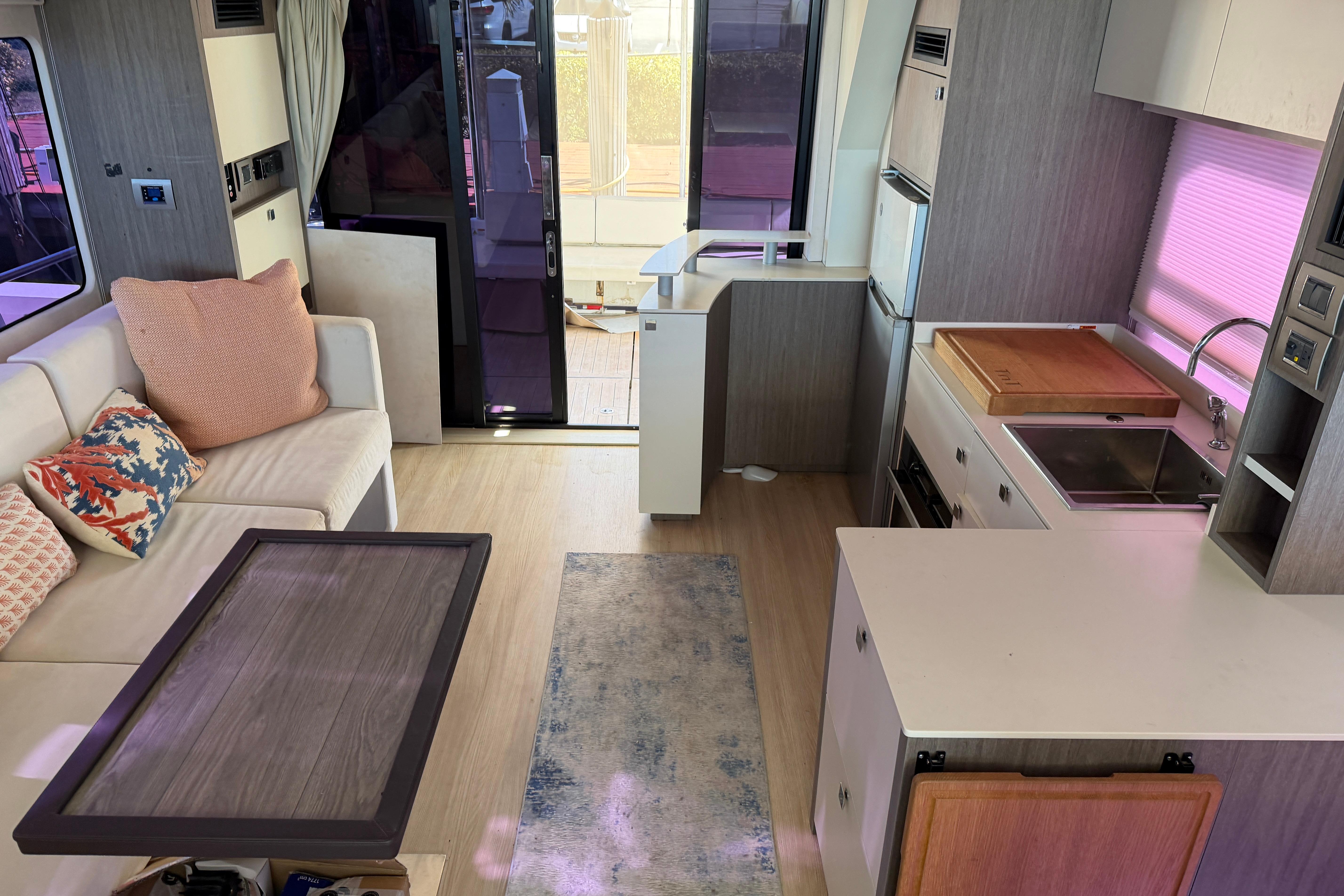 Modern interior of 2016 Cranchi Eco Trawler 53 Long Distance yacht with kitchen and seating area.